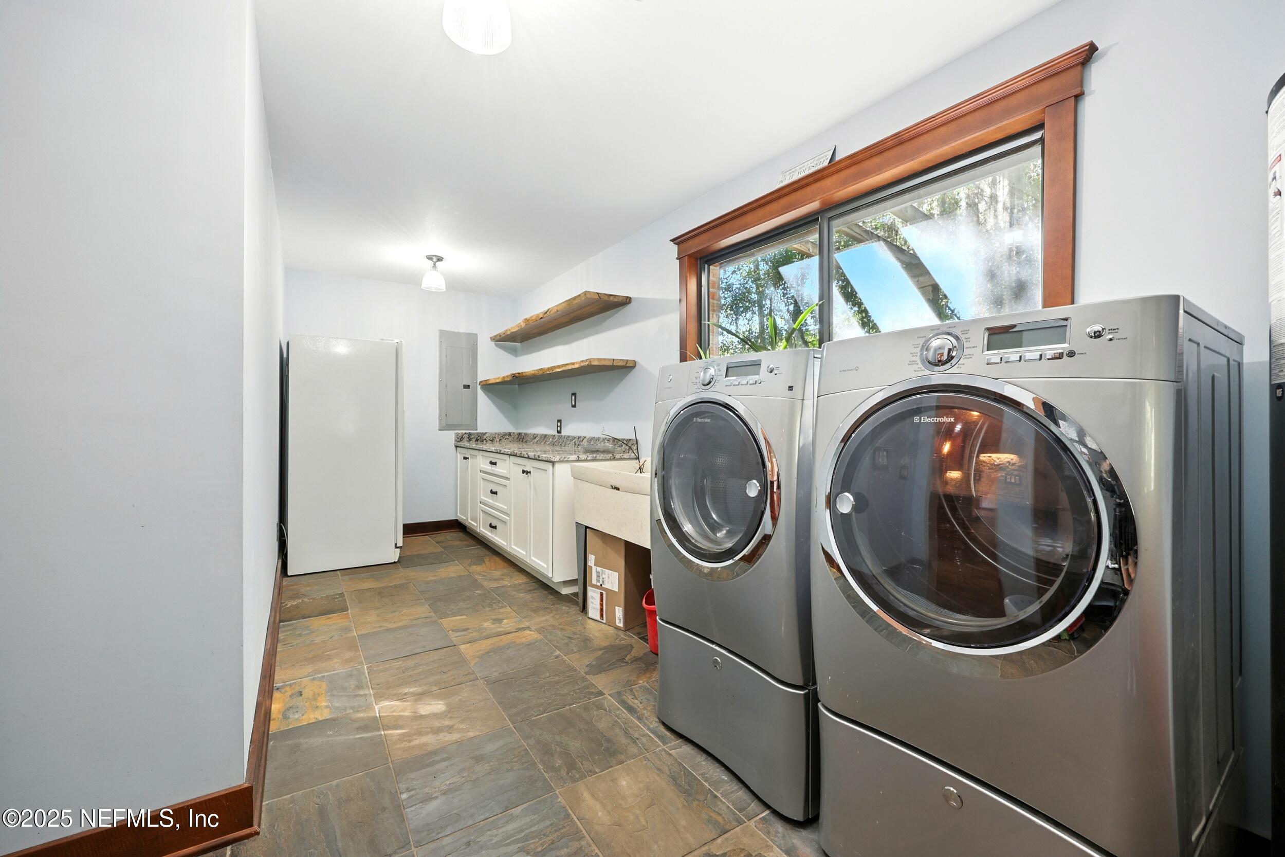 12534 Flynn Road Jacksonville, FL 32223 - Photo 45 of 90 a utility room with dryer and washer