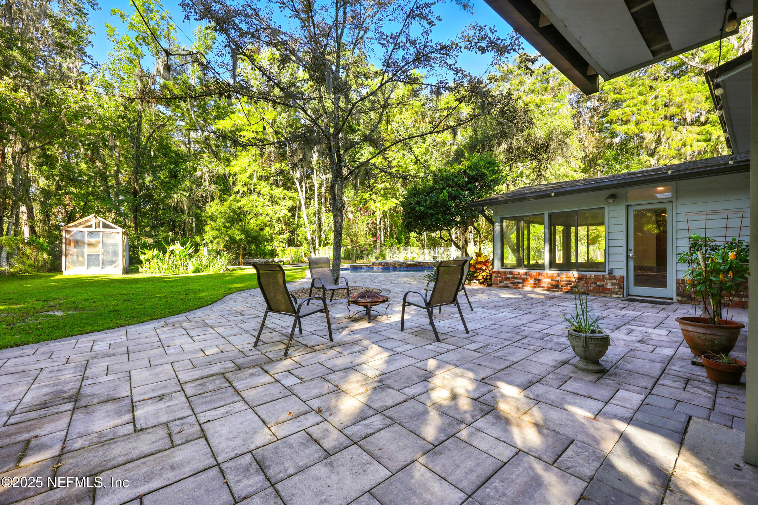 12534 Flynn Road Jacksonville, FL 32223 - Photo 48 of 90 a view of a backyard with sitting area