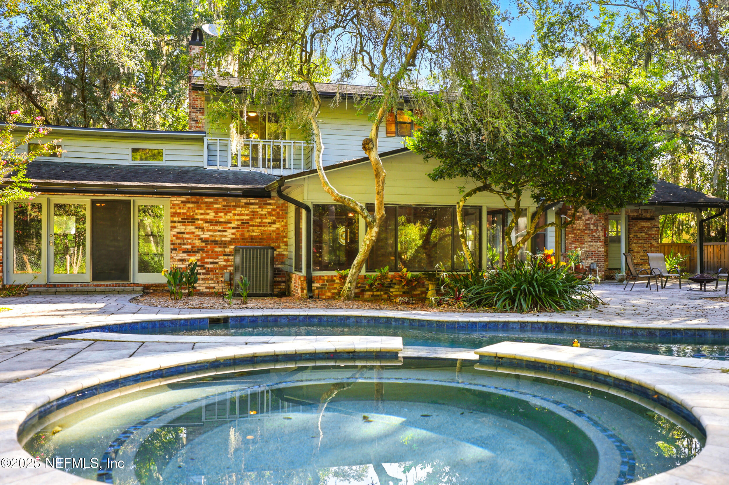 12534 Flynn Road Jacksonville, FL 32223 - Photo 63 of 90 a view of swimming pool with a patio