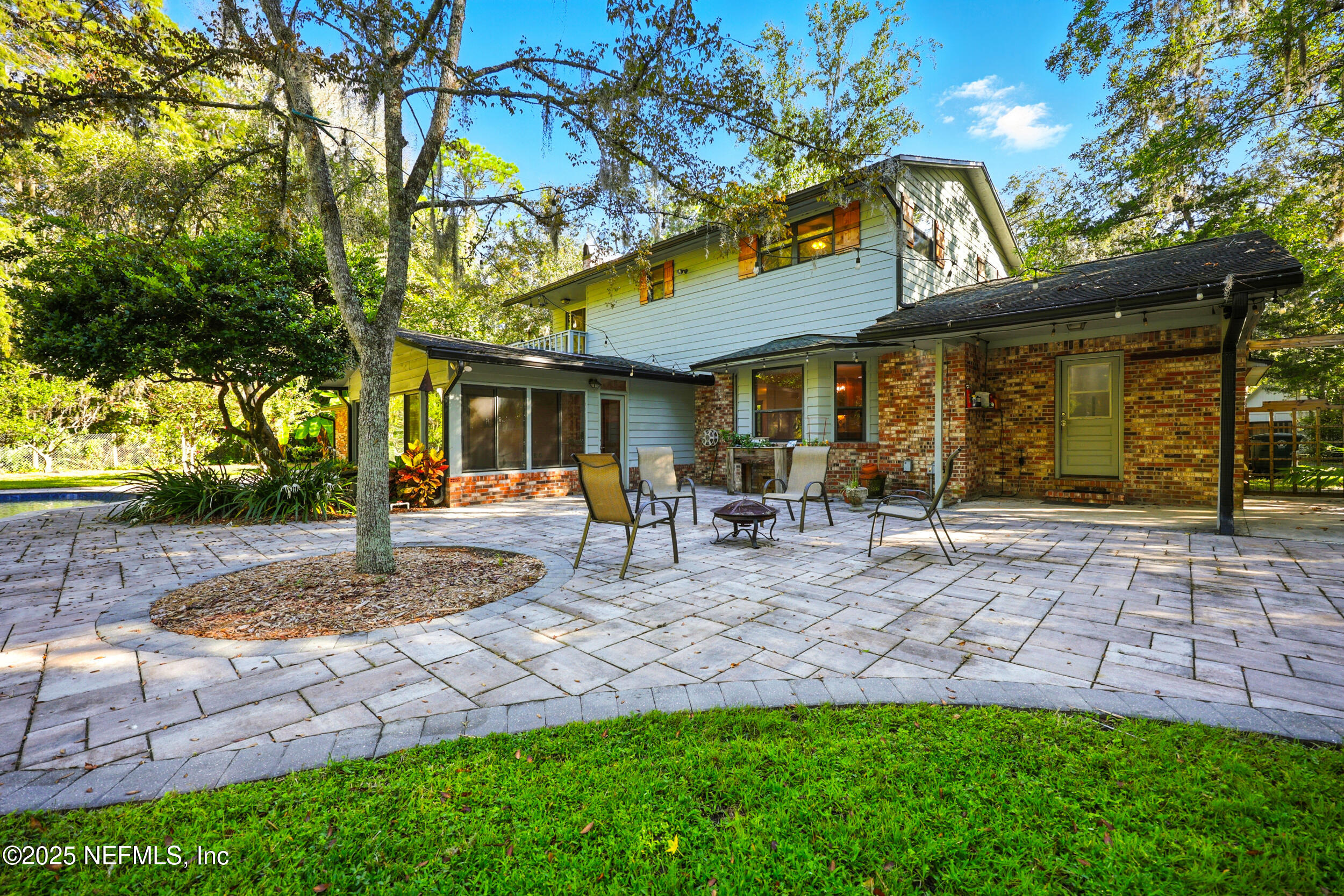 12534 Flynn Road Jacksonville, FL 32223 - Photo 64 of 90 a view of a patio with table and chairs with wooden fence and plants