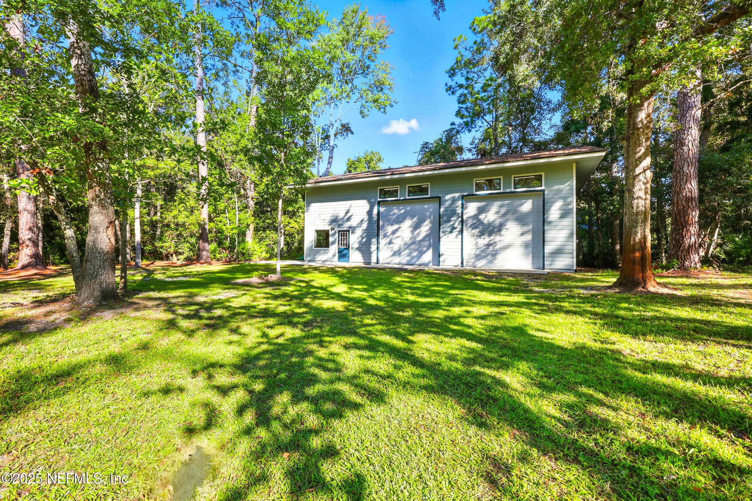 12534 Flynn Road Jacksonville, FL 32223 - Photo 66 of 90 a view of a back yard of the house with green space