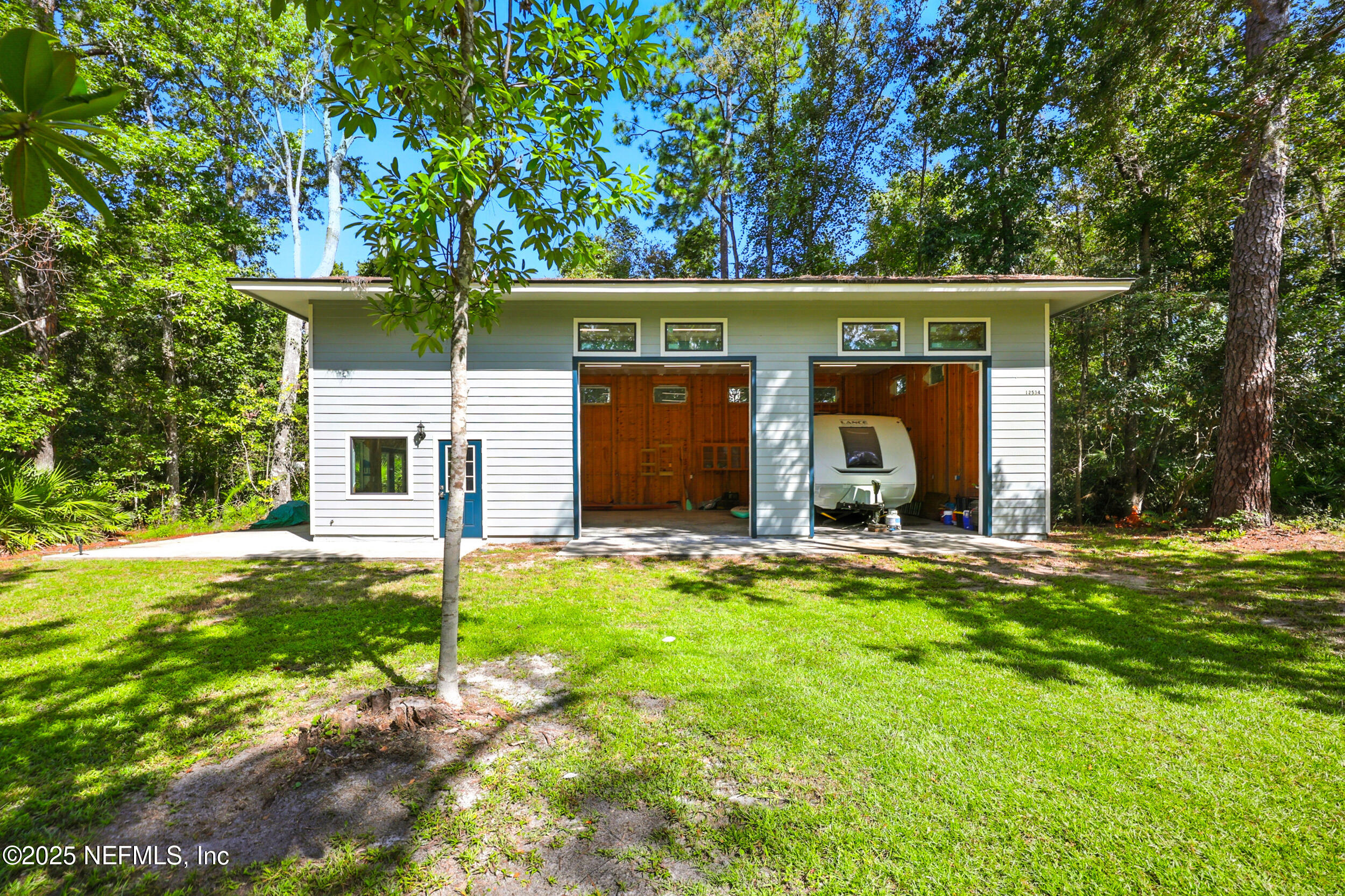 12534 Flynn Road Jacksonville, FL 32223 - Photo 67 of 90 front view of a house with a yard