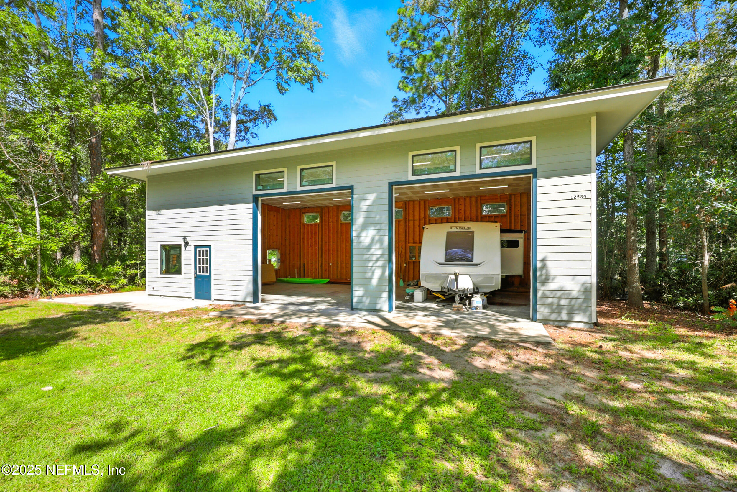 12534 Flynn Road Jacksonville, FL 32223 - Photo 68 of 90 a front view of a house with a yard