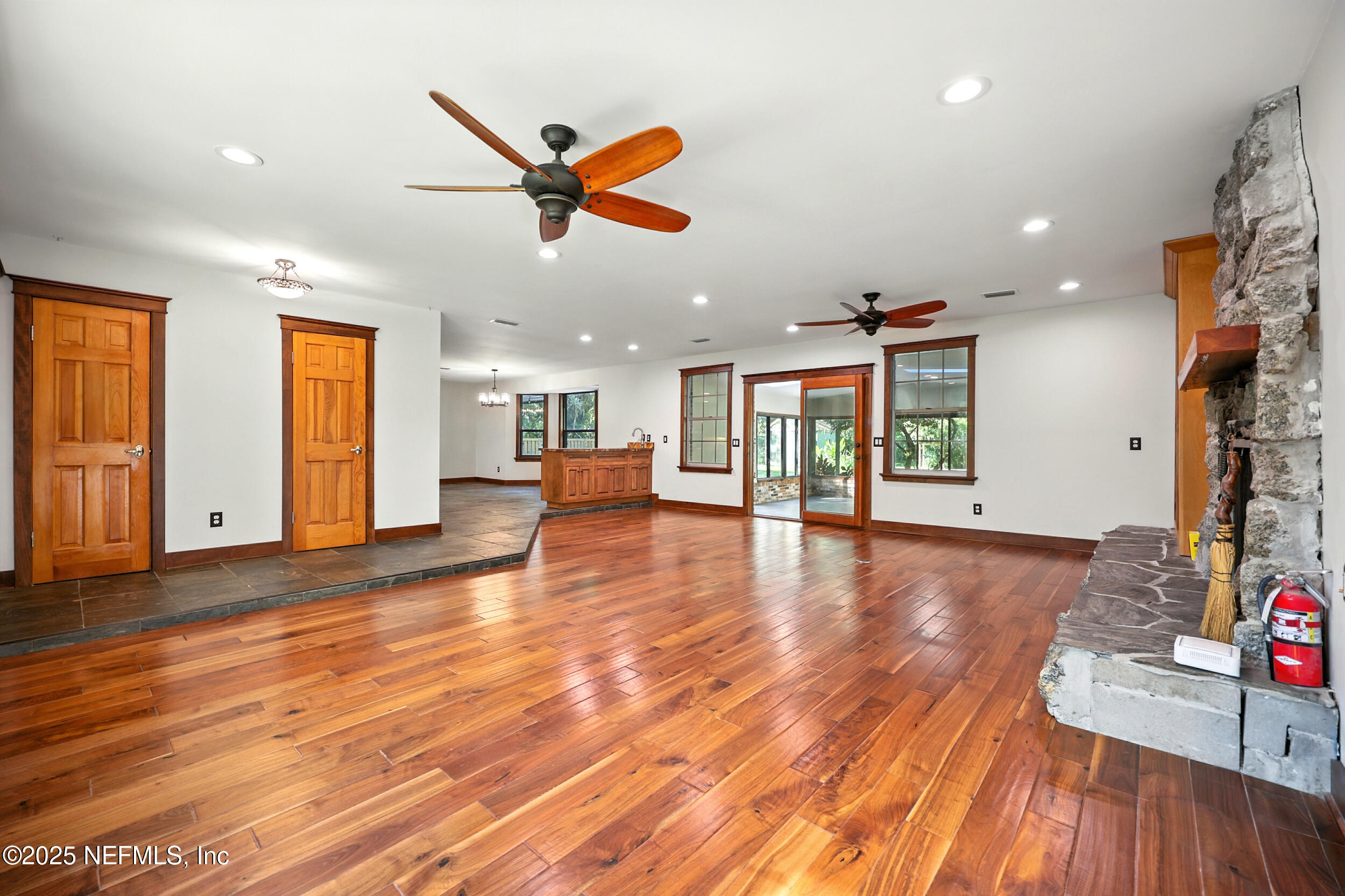 12534 Flynn Road Jacksonville, FL 32223 - Photo 7 of 90 a view of a livingroom with hardwood floor and a ceiling fan