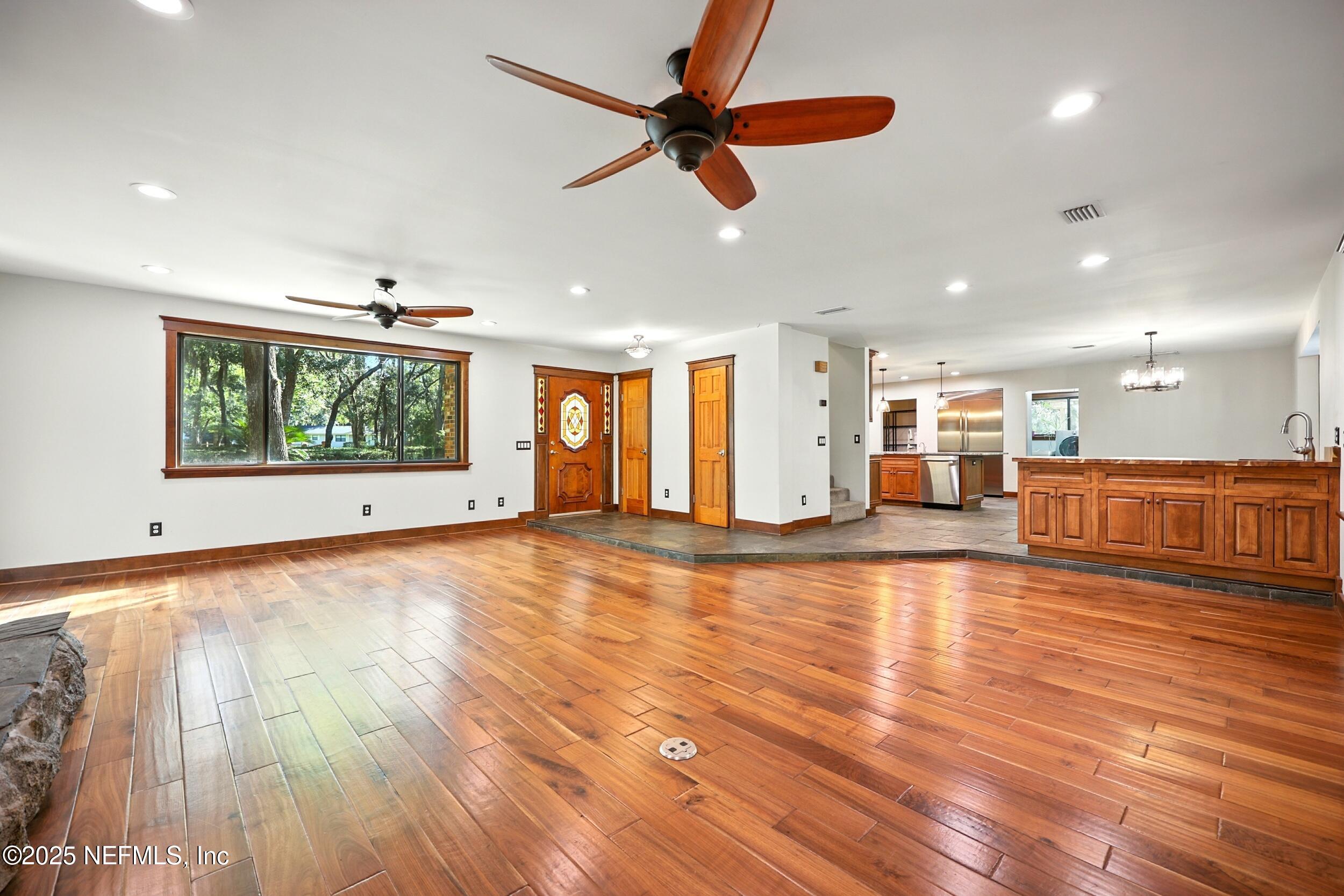 12534 Flynn Road Jacksonville, FL 32223 - Photo 8 of 90 a view of a kitchen with a sink and wooden floor