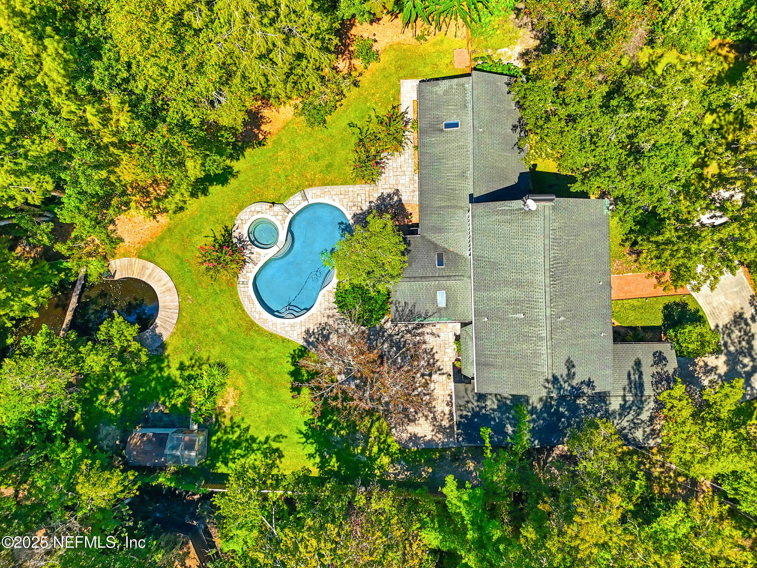 12534 Flynn Road Jacksonville, FL 32223 - Photo 88 of 90 an aerial view of a house with a yard and trees all around