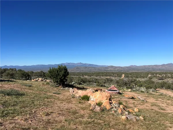 a view of a town with mountains in the background