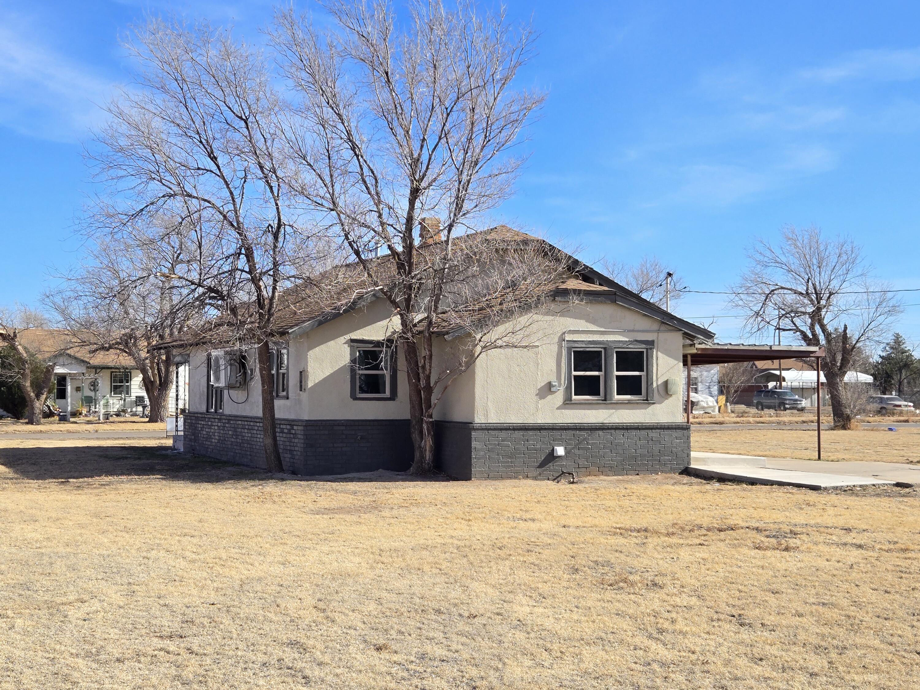 315 North Floyd Avenue Tulia, TX 79088 - Photo 23 of 24 a front view of a house with a yard