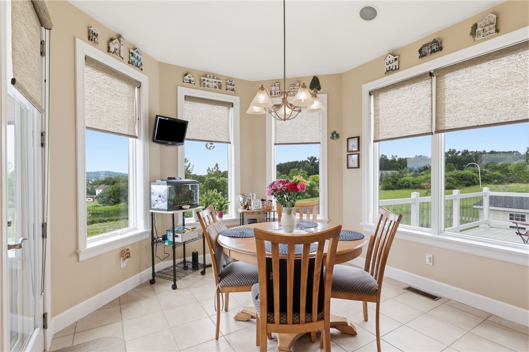 4536 Crystal Ridge Circle Gorham, NY 14424 - Photo 14 of 48 This bright and inviting eat-in dining area offering breathtaking, panoramic views of the scenic lake.