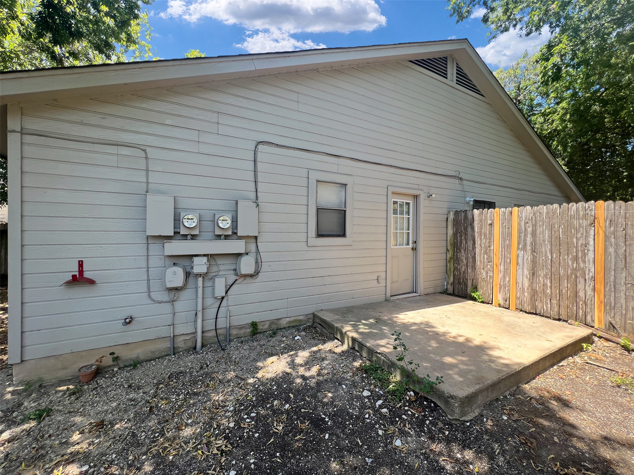 2010 Alex Avenue, Unit B Austin, TX 78728 - Photo 19 of 20 Backyard with an Open Patio and with a Wooden Fence