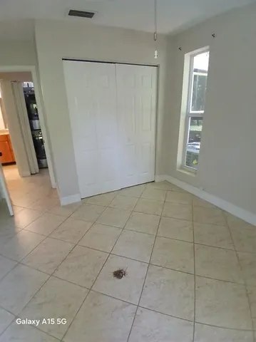 a swimming pool with outdoor seating and yard