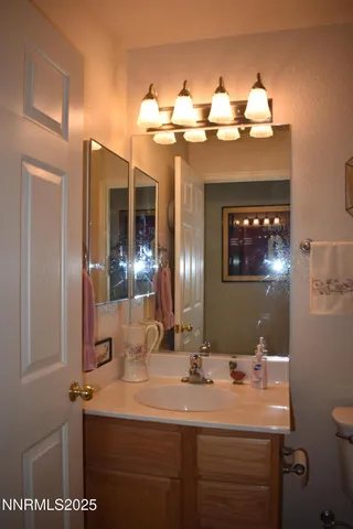 a bathroom with a sink double vanity and a mirror