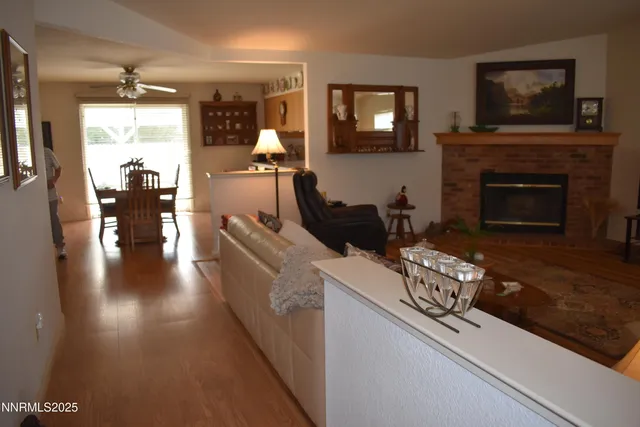 a living room with furniture fireplace and flat screen tv
