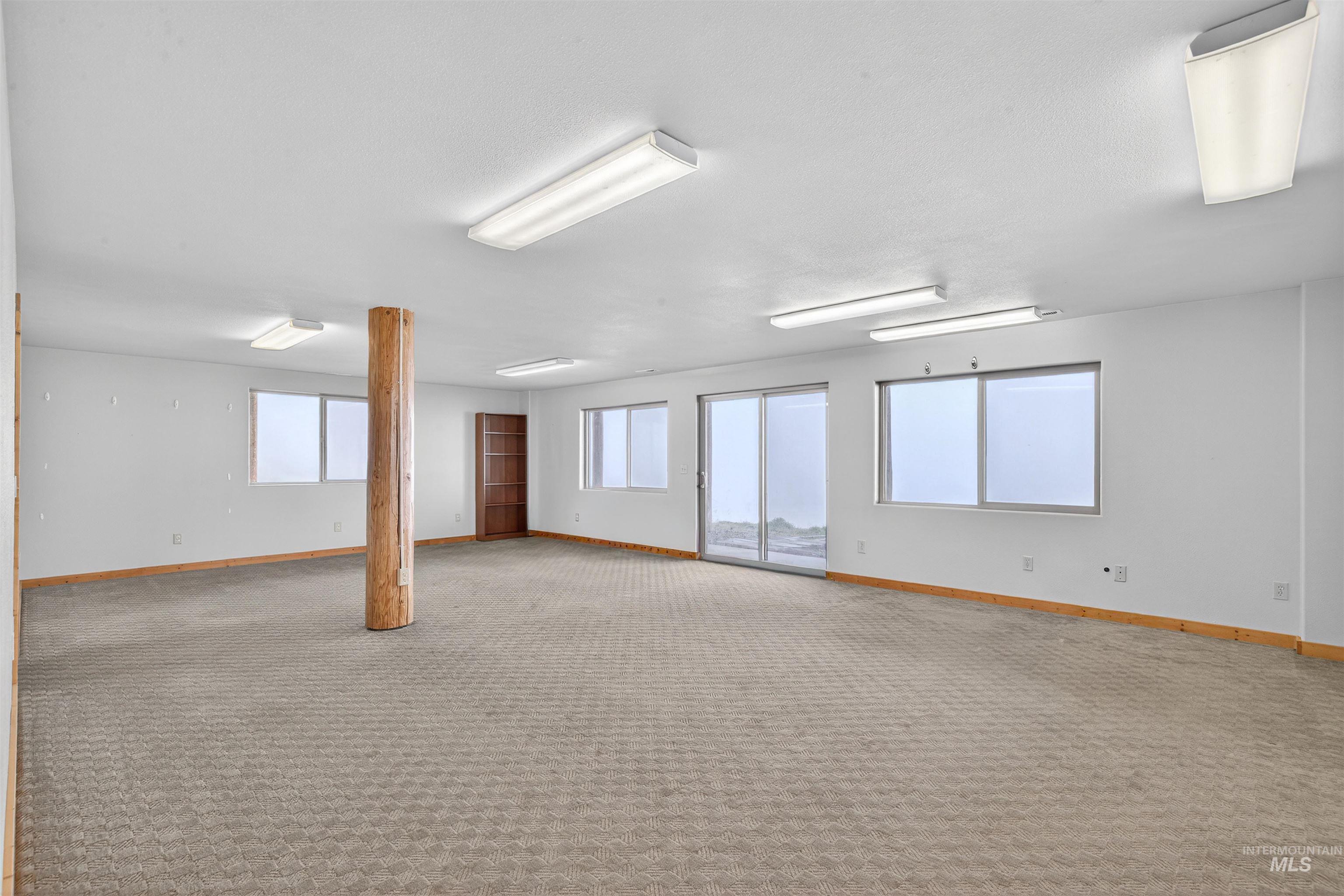 915 Doumecq Road White Bird, ID 83554 - Photo 41 of 49 Empty room with baseboards and light carpet