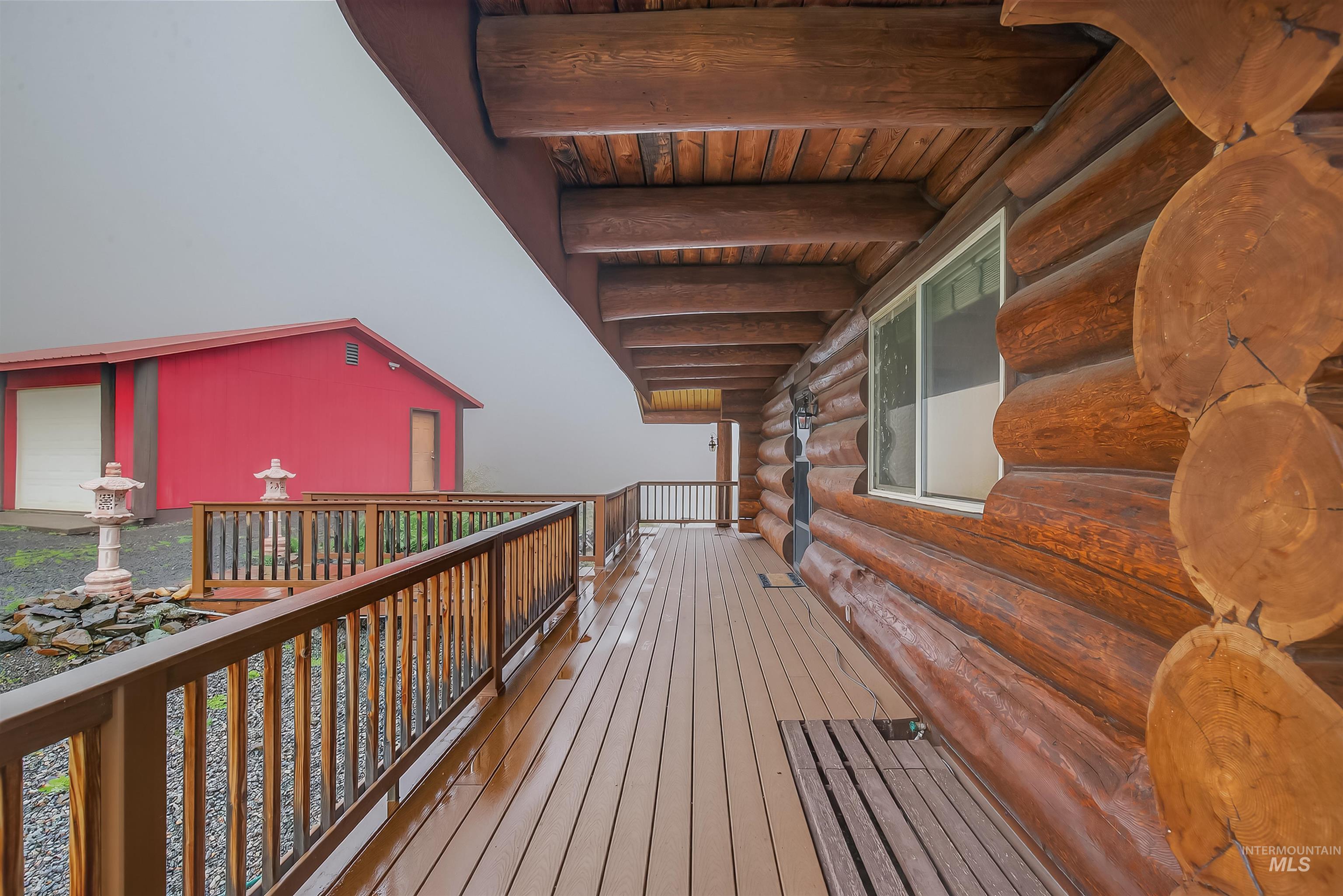 915 Doumecq Road White Bird, ID 83554 - Photo 46 of 49 Wooden deck featuring a garage