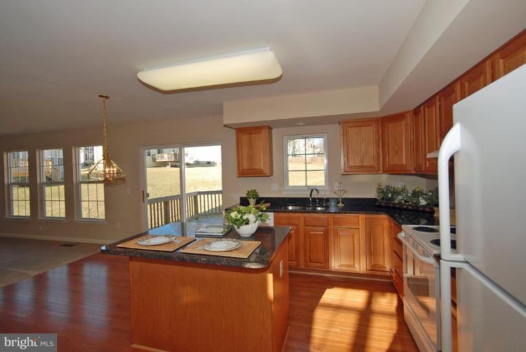 5970 Florey Road Hanover, MD 21076 - Photo 13 of 30 a view of a living room and dining room