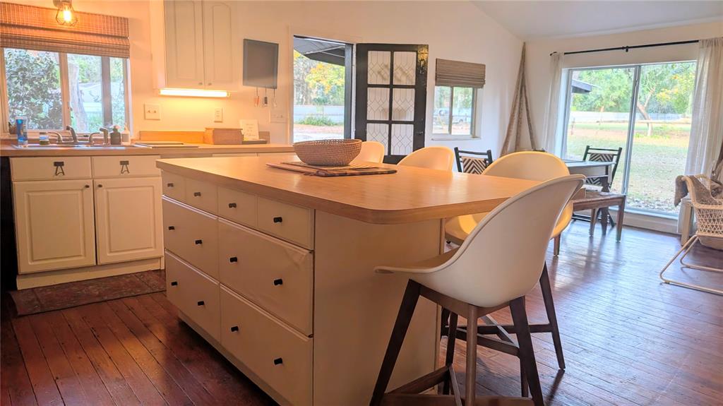 9350 Southeast 170th Avenue Road Ocklawaha, FL 32179 - Photo 12 of 69 a dining table with chairs and wooden floor