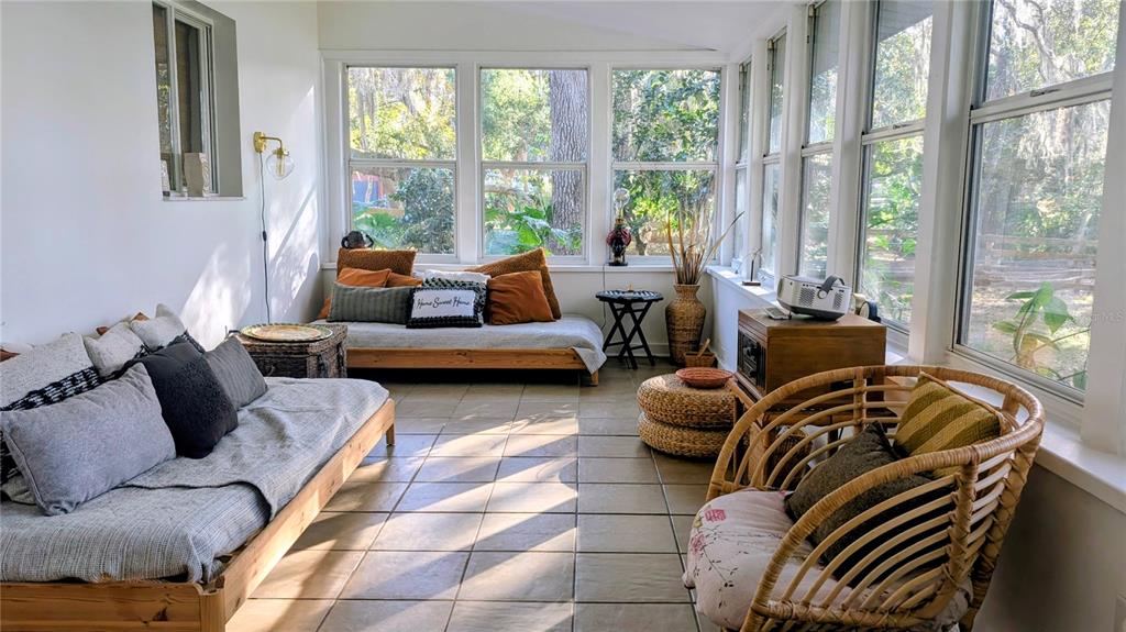 9350 Southeast 170th Avenue Road Ocklawaha, FL 32179 - Photo 27 of 69 a living room with furniture and a large window
