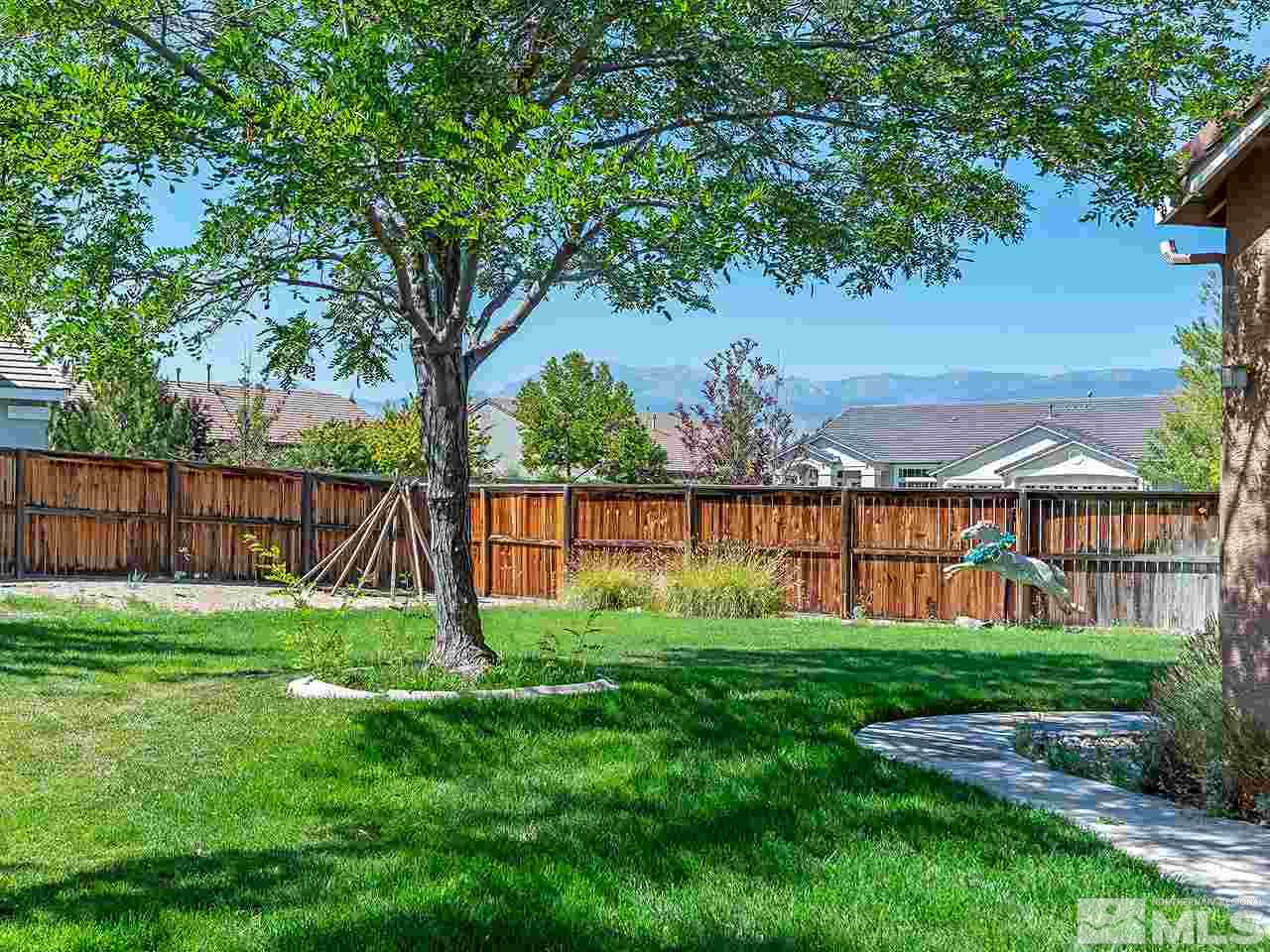 1790 Oxcart Court Reno, NV 89521 - Photo 3 of 20 a view of a garden with a small cabin