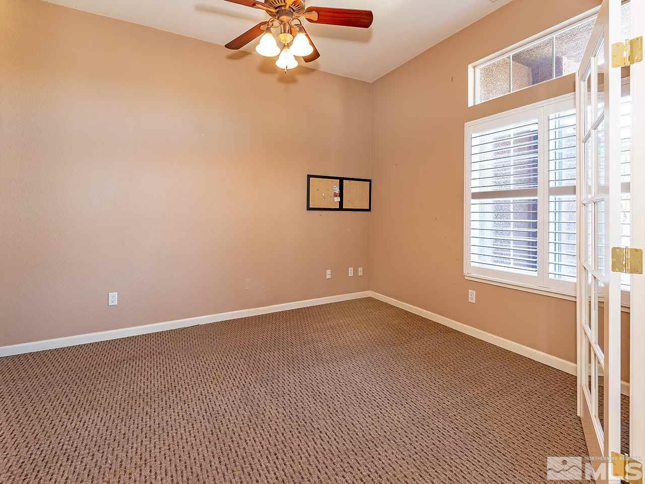 1790 Oxcart Court Reno, NV 89521 - Photo 8 of 20 an empty room with a window