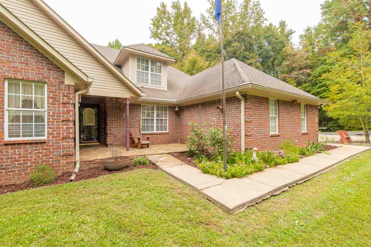 414 Simmons Road Munford, TN 38058 - Photo 1 of 24 This Beautiful Home Sits on a 4 Acre Estate In Unincorporated Tipton County. A Long Winding Driveway Takes You Past The Deer and Turkey To Your Home!