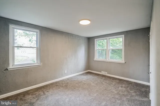 an empty room with windows