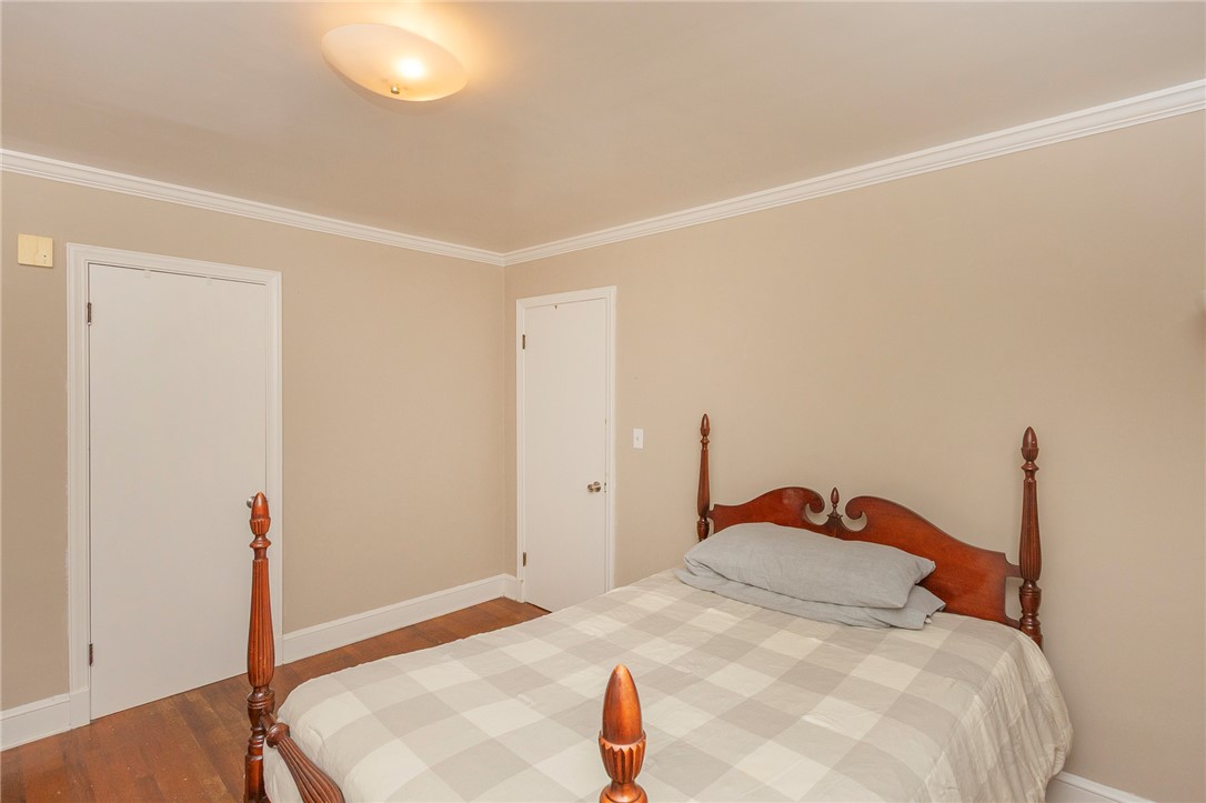 1218 Bolt Drive Anderson, SC 29621 - Photo 28 of 46 Timeless wood flooring grounds this cozy bedroom, framed by classic crown molding.