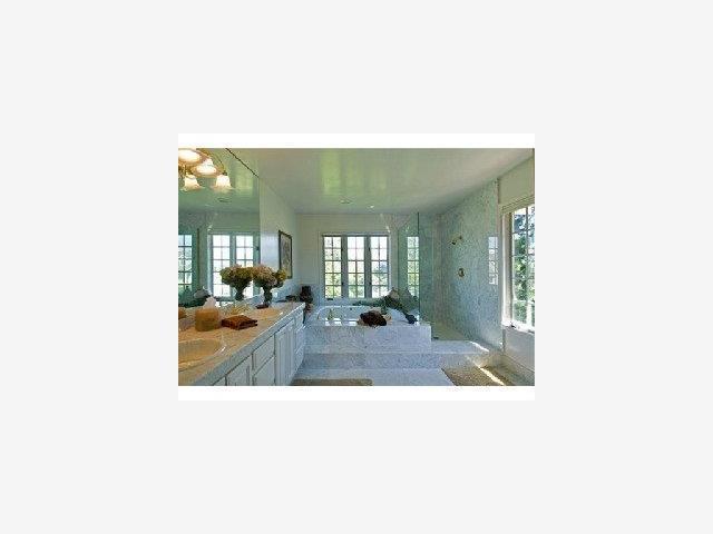 198 Cypress Point Road Half Moon Bay, CA 94019 - Photo 7 of 8 a picture of a living room with a rug and a large window