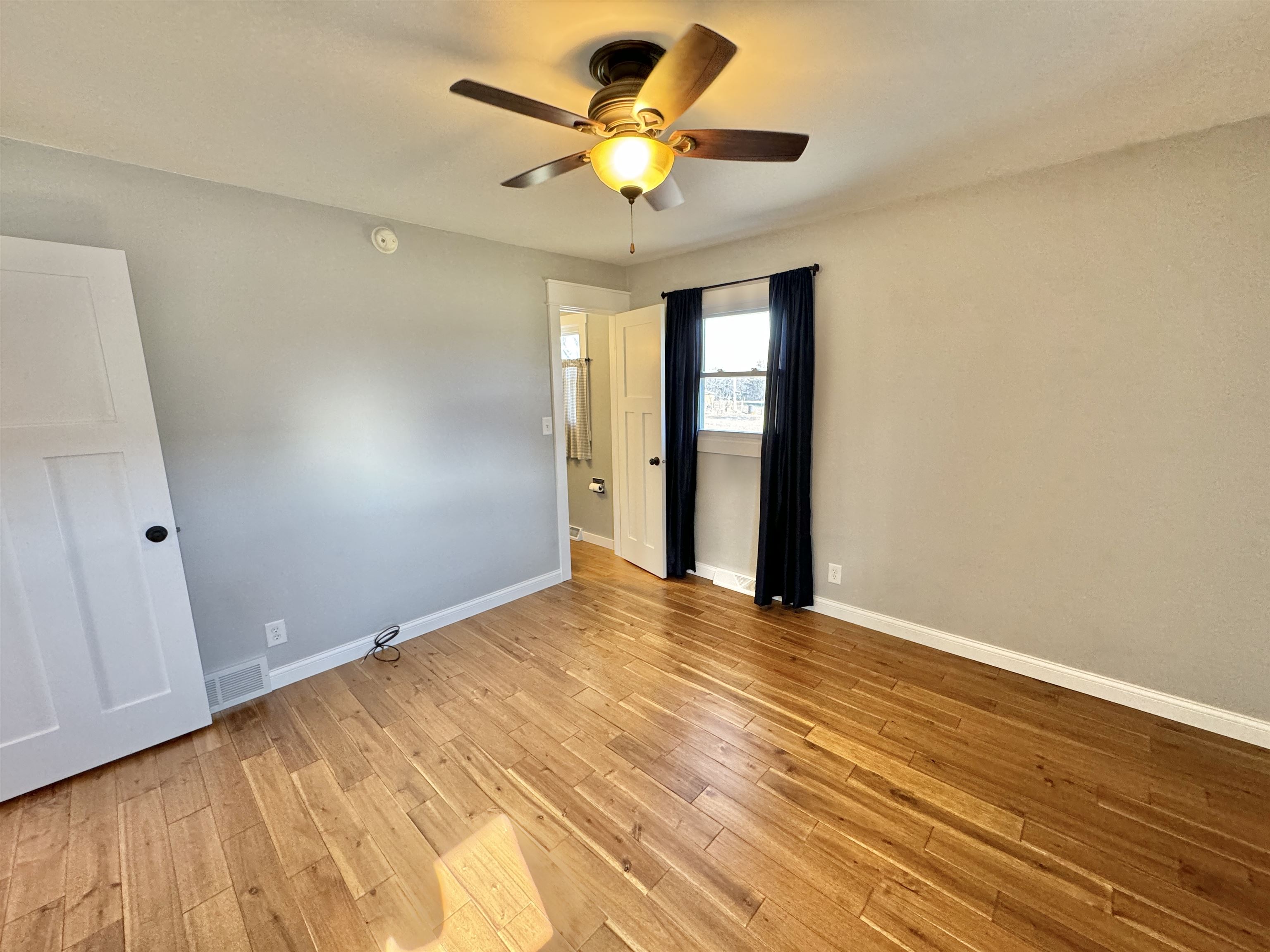 6694 Belvidere Road Roscoe, IL 61073 - Photo 20 of 32 a view of an empty room with a window
