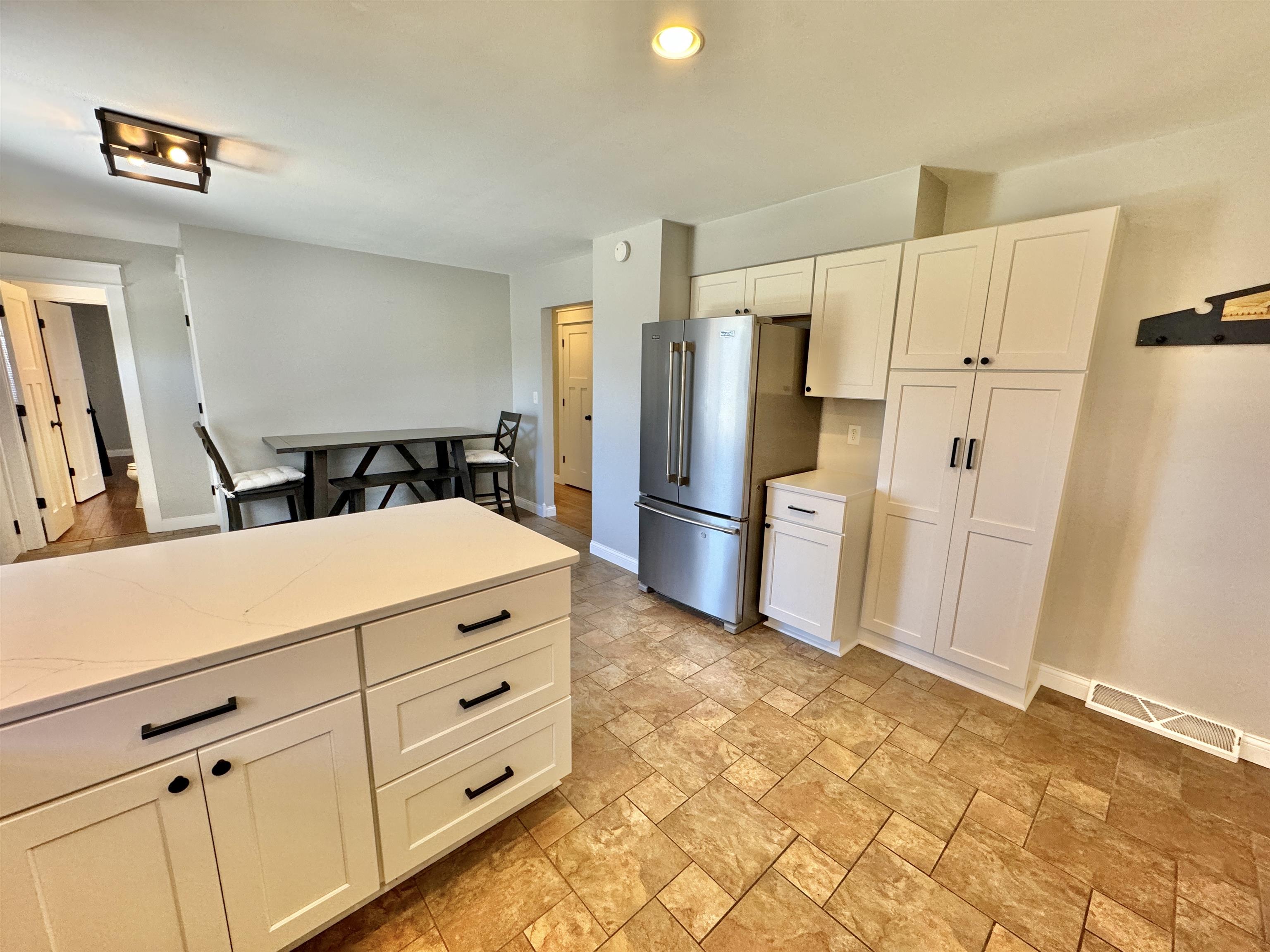 6694 Belvidere Road Roscoe, IL 61073 - Photo 21 of 32 a kitchen with cabinets and stainless steel appliances