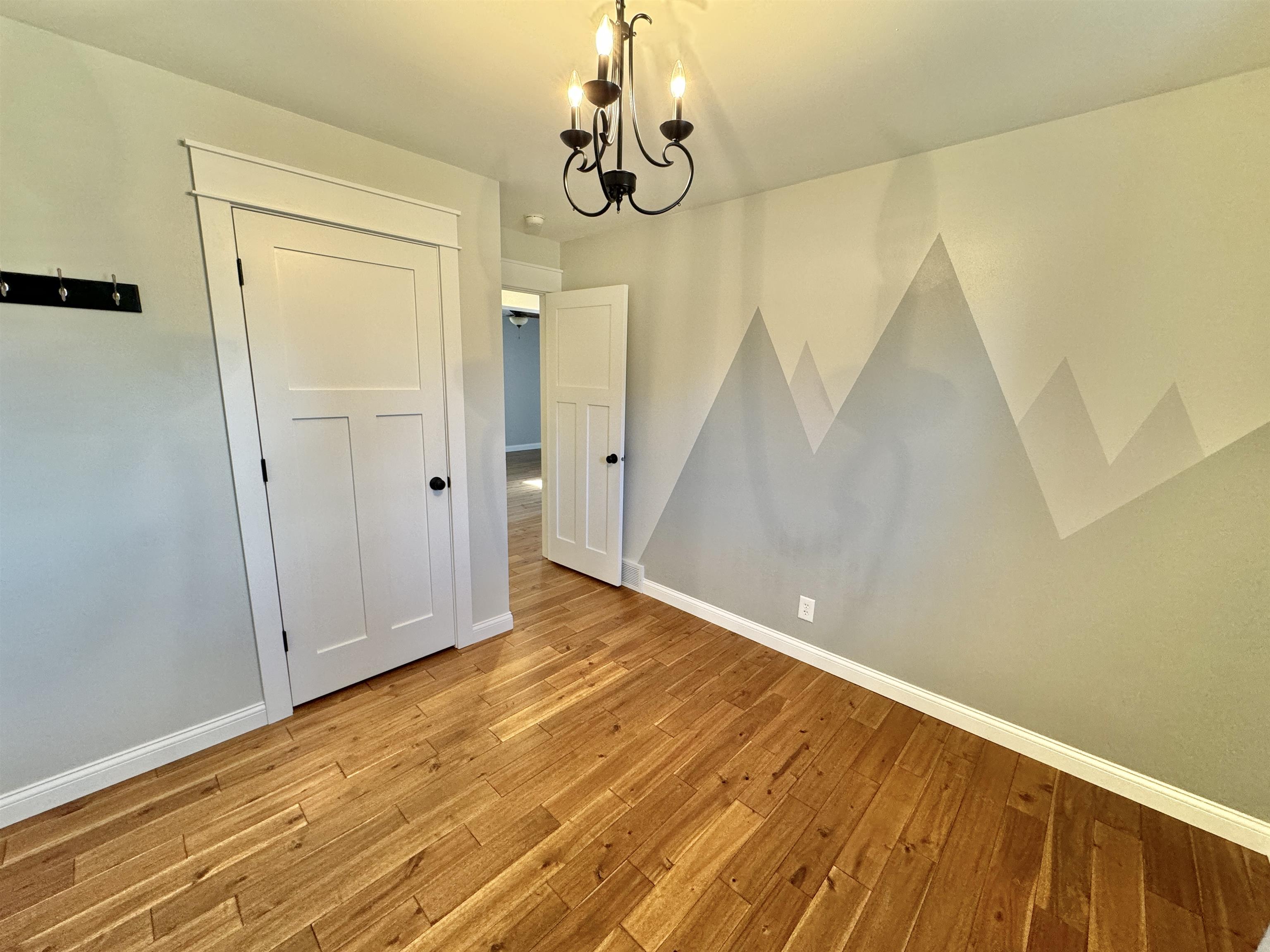 6694 Belvidere Road Roscoe, IL 61073 - Photo 24 of 32 a view of empty room with wooden floor