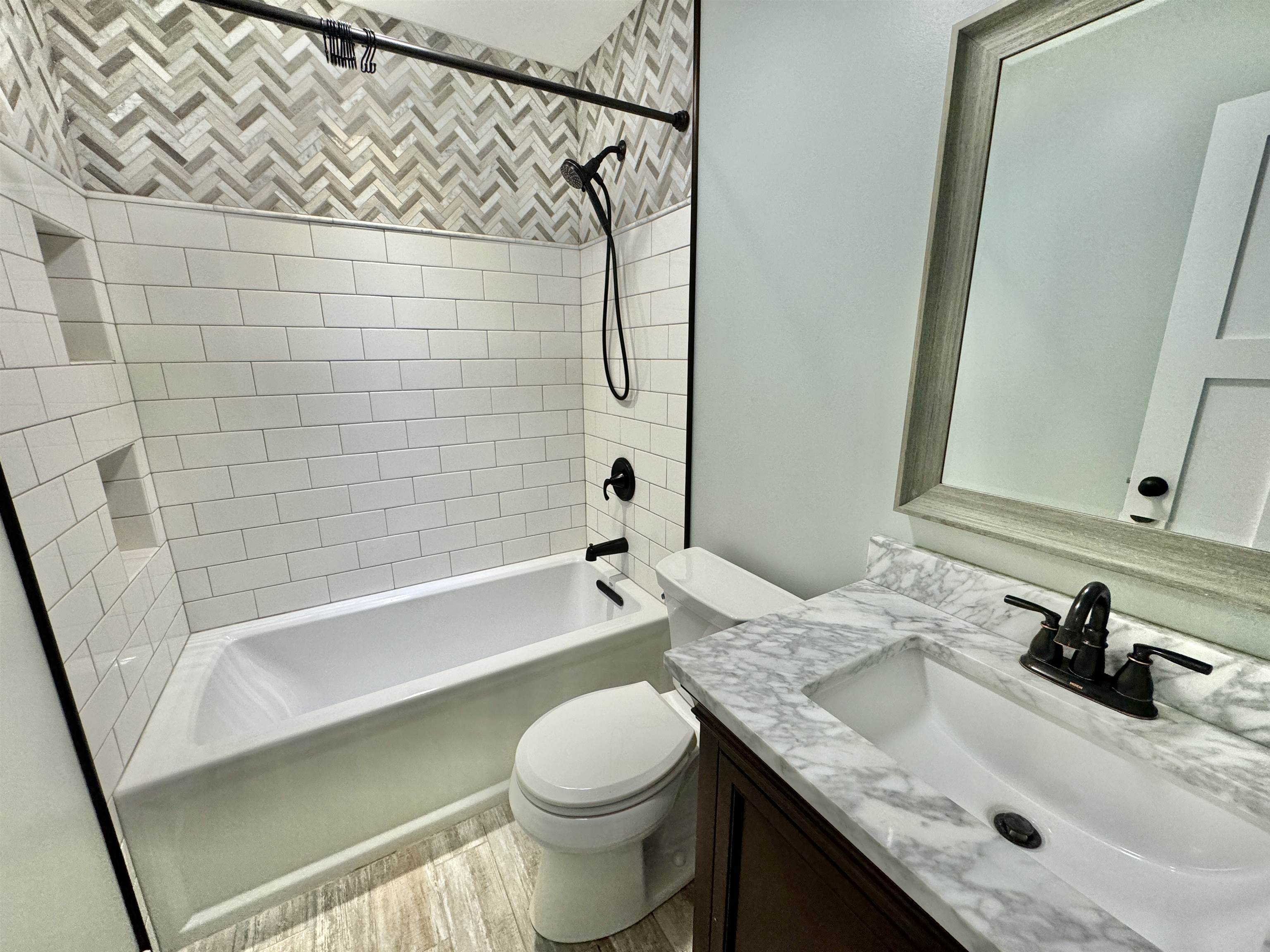 6694 Belvidere Road Roscoe, IL 61073 - Photo 26 of 32 a bathroom with a granite countertop sink toilet and shower