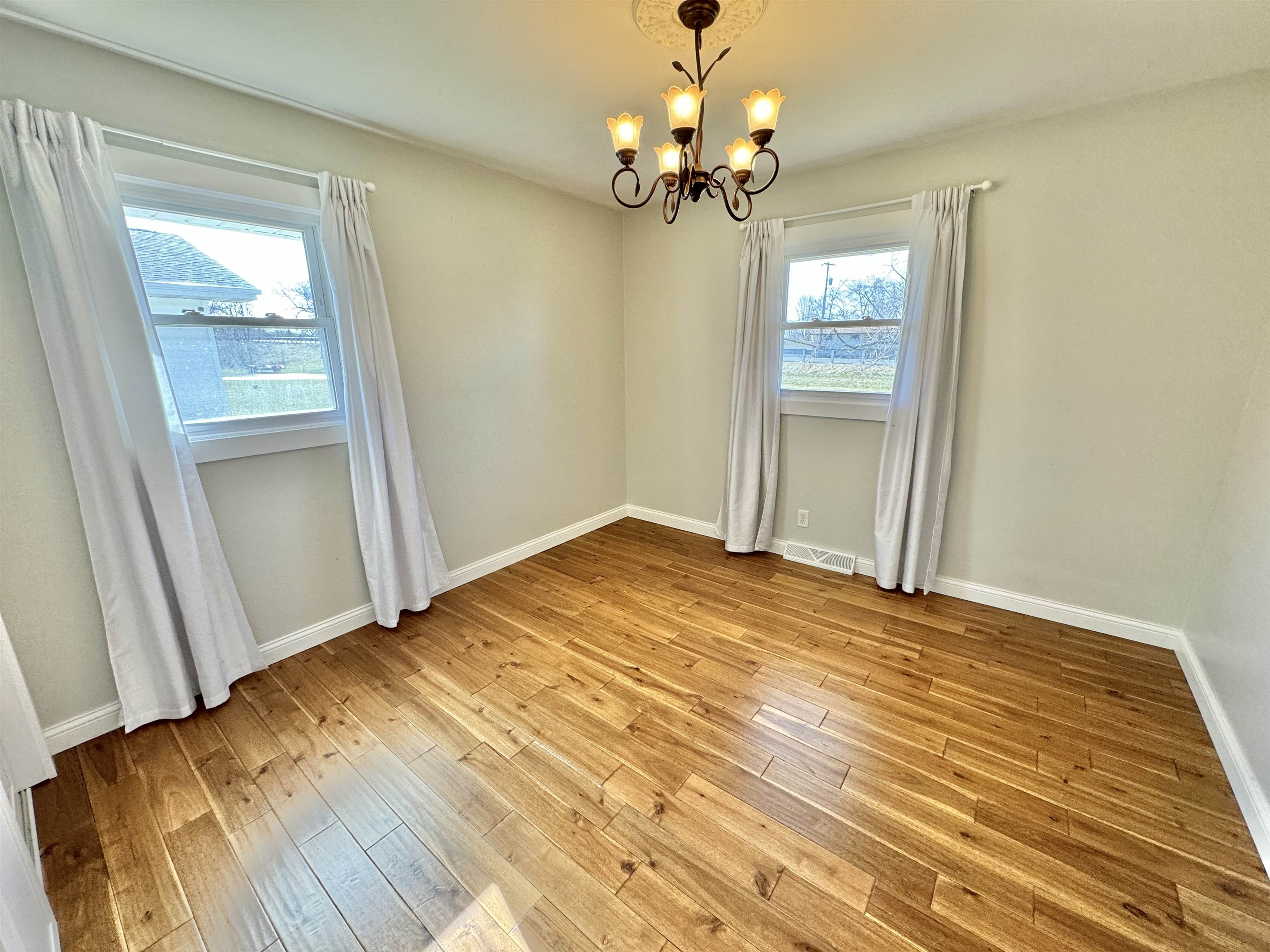 6694 Belvidere Road Roscoe, IL 61073 - Photo 27 of 32 a view of empty room with wooden floor