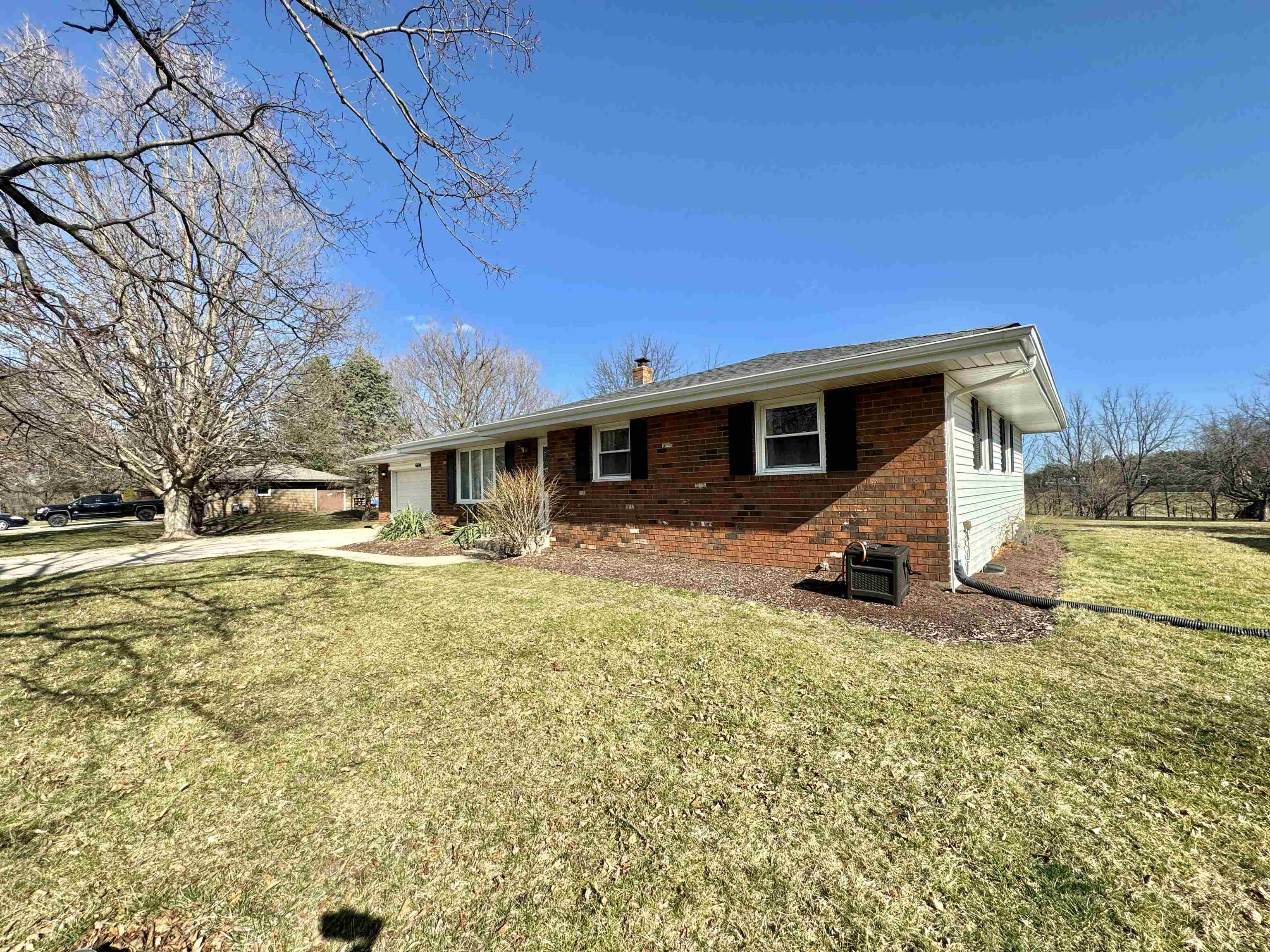 6694 Belvidere Road Roscoe, IL 61073 - Photo 4 of 32 a view of a house with a patio