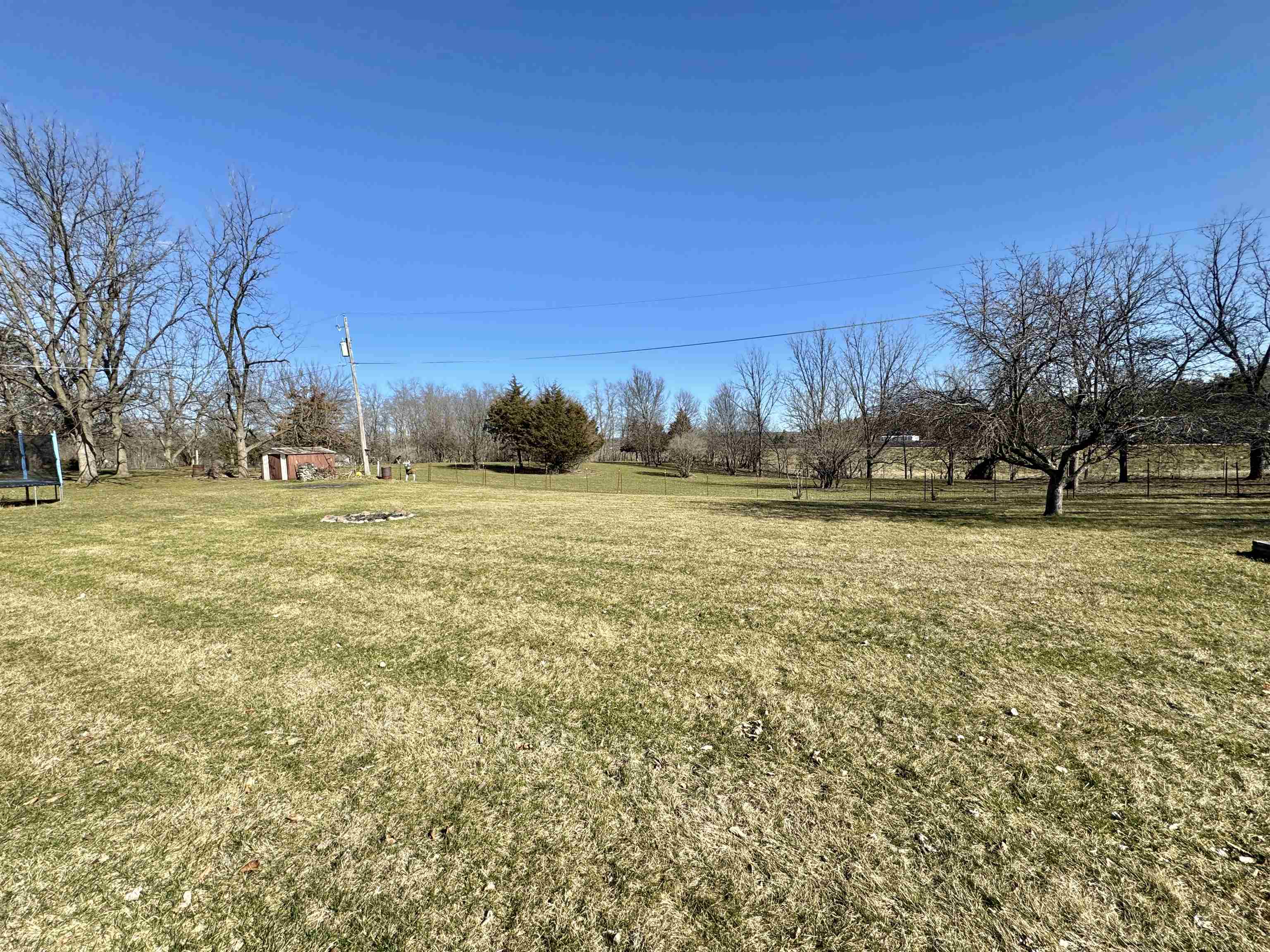 6694 Belvidere Road Roscoe, IL 61073 - Photo 7 of 32 a view of outdoor space with trees all around