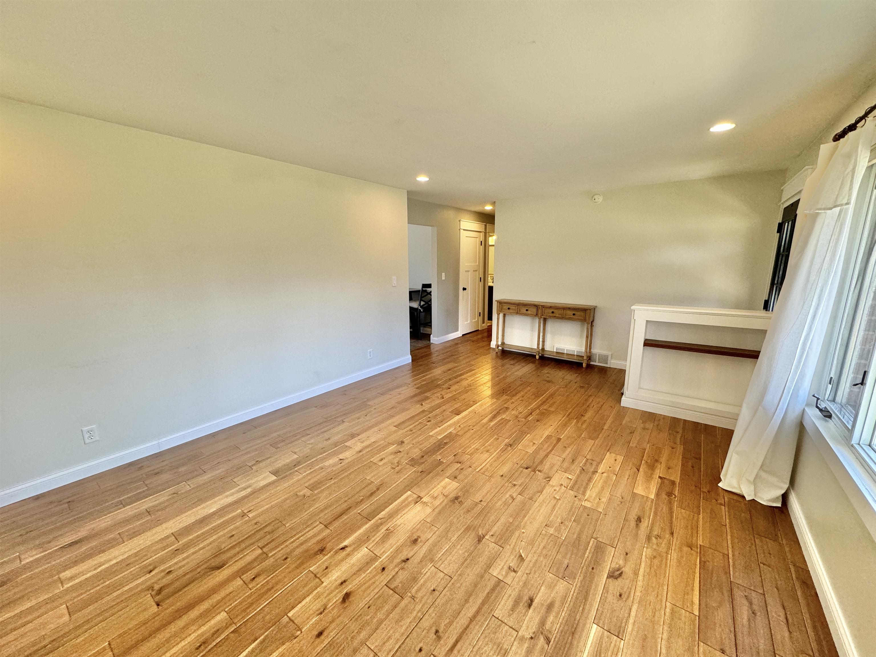 6694 Belvidere Road Roscoe, IL 61073 - Photo 10 of 32 a view of empty room with wooden floor