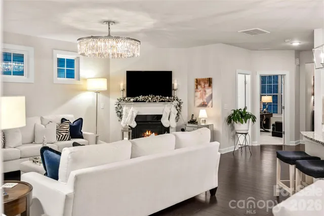 a living room with fireplace furniture and a flat screen tv