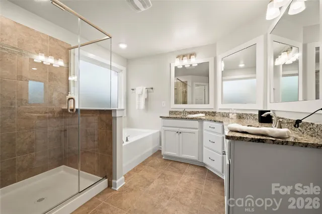 a bed room with a bed and a chandelier