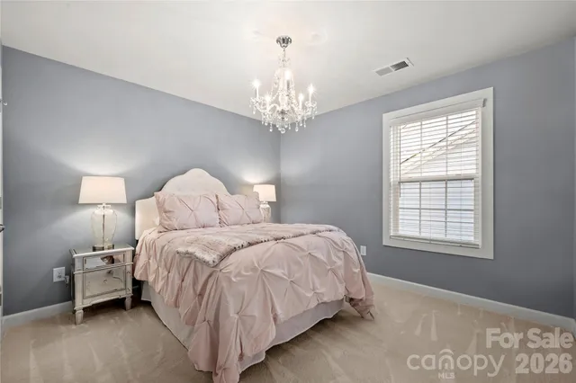 a bathroom with a granite countertop sink a toilet and a mirror