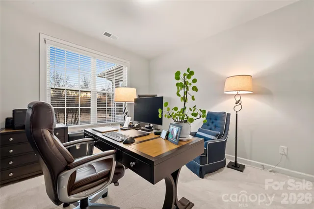 a view of a workspace with furniture