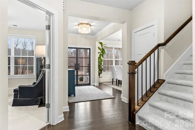 a view of entryway and hall with wooden floor