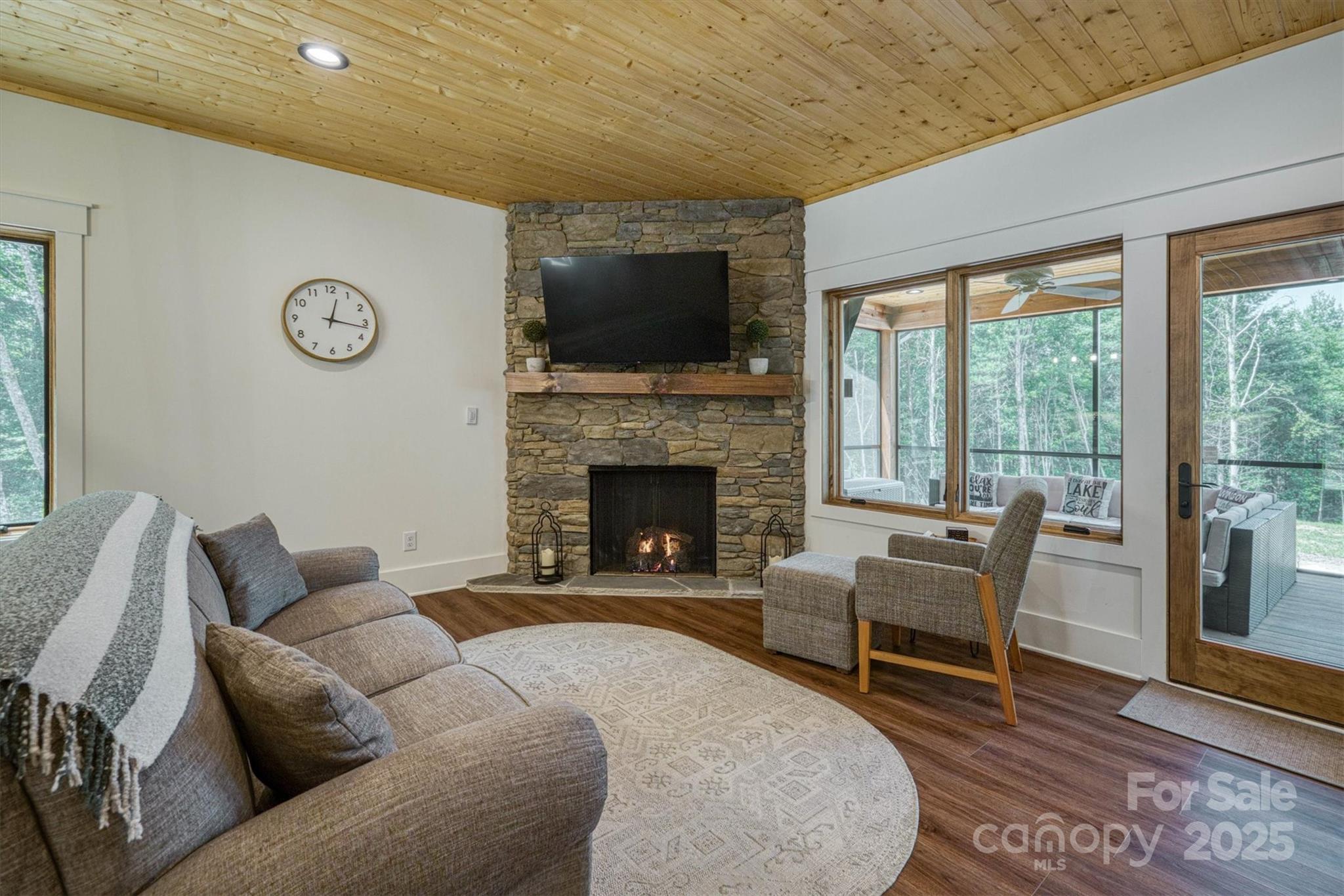 1370 Saylor Way, Unit 8 Nebo, NC 28761 - Photo 22 of 44 a living room with furniture a flat screen tv and a fireplace