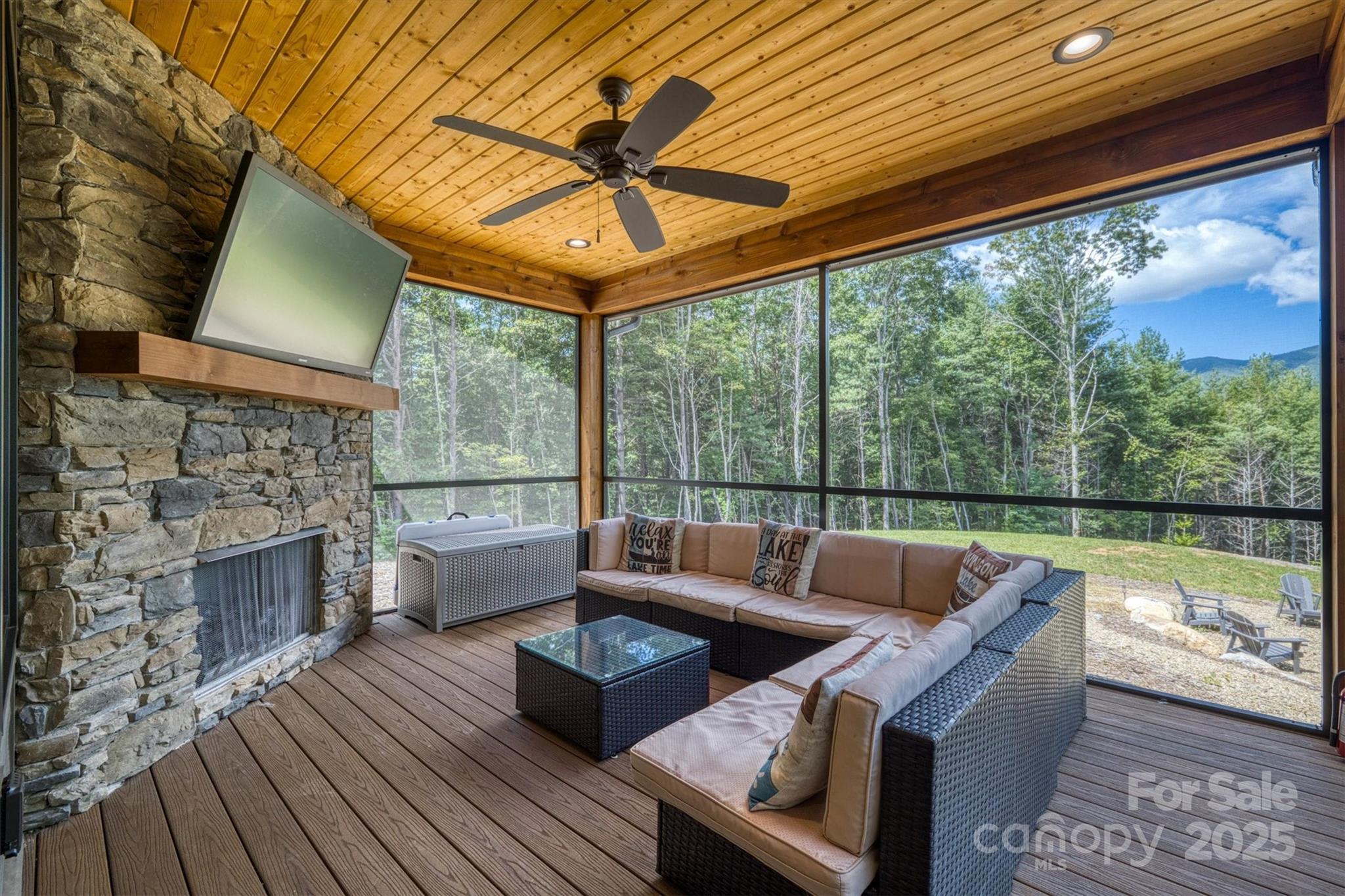 1370 Saylor Way, Unit 8 Nebo, NC 28761 - Photo 26 of 44 a living room with fireplace furniture and a large window