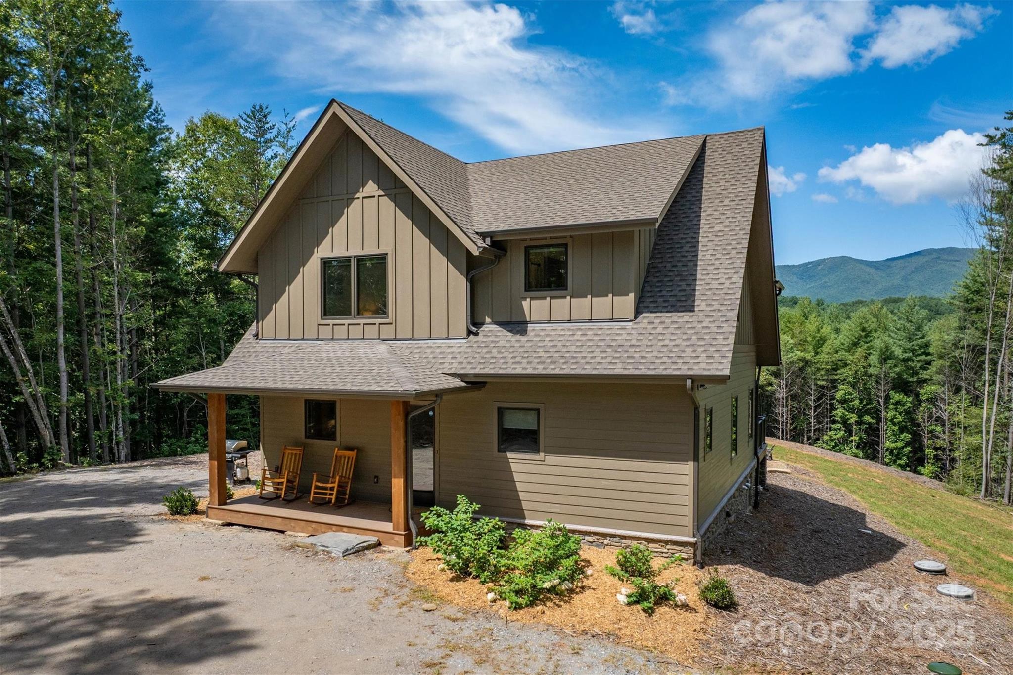 1370 Saylor Way, Unit 8 Nebo, NC 28761 - Photo 3 of 44 a front view of a house with garden
