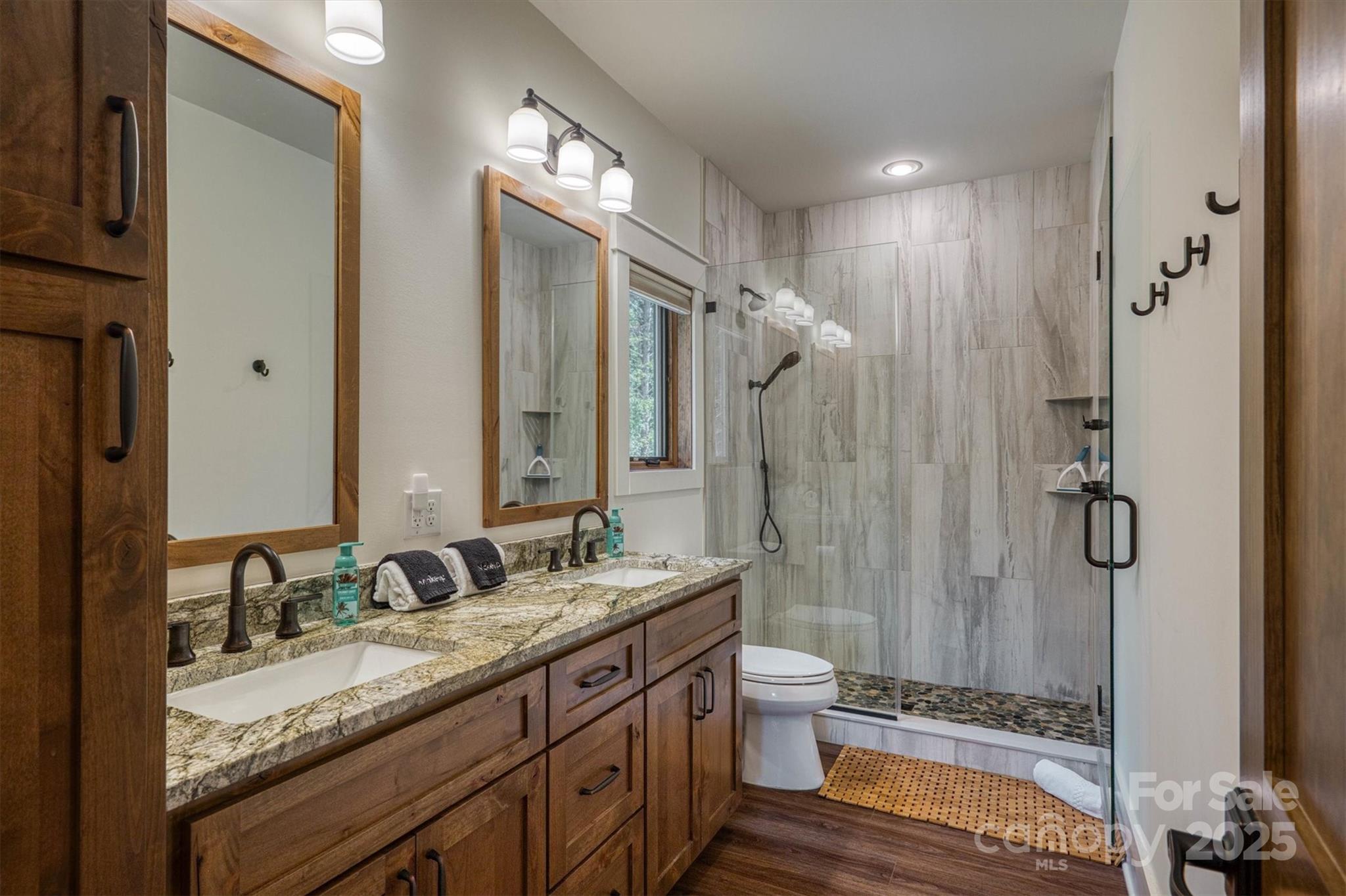1370 Saylor Way, Unit 8 Nebo, NC 28761 - Photo 32 of 44 a bathroom with a granite countertop sink toilet and shower