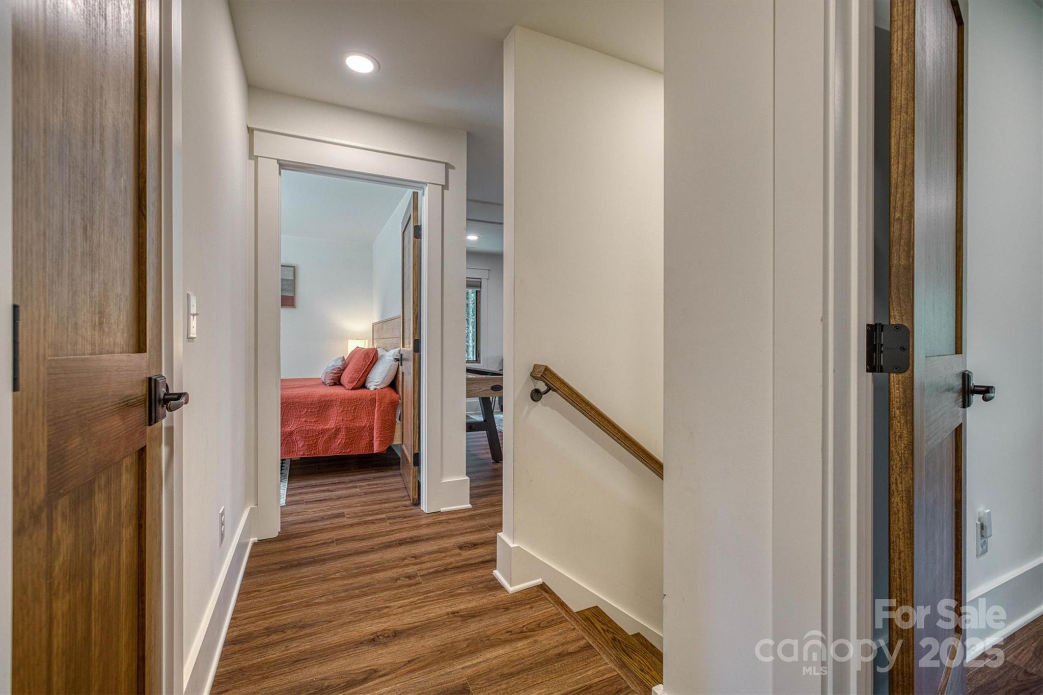 1370 Saylor Way, Unit 8 Nebo, NC 28761 - Photo 36 of 44 a room that has a bed and a mirror