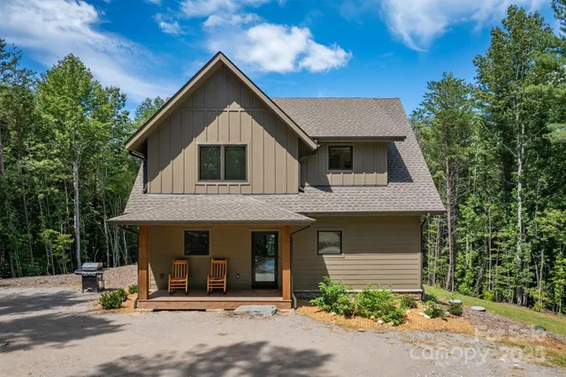a front view of a house with yard