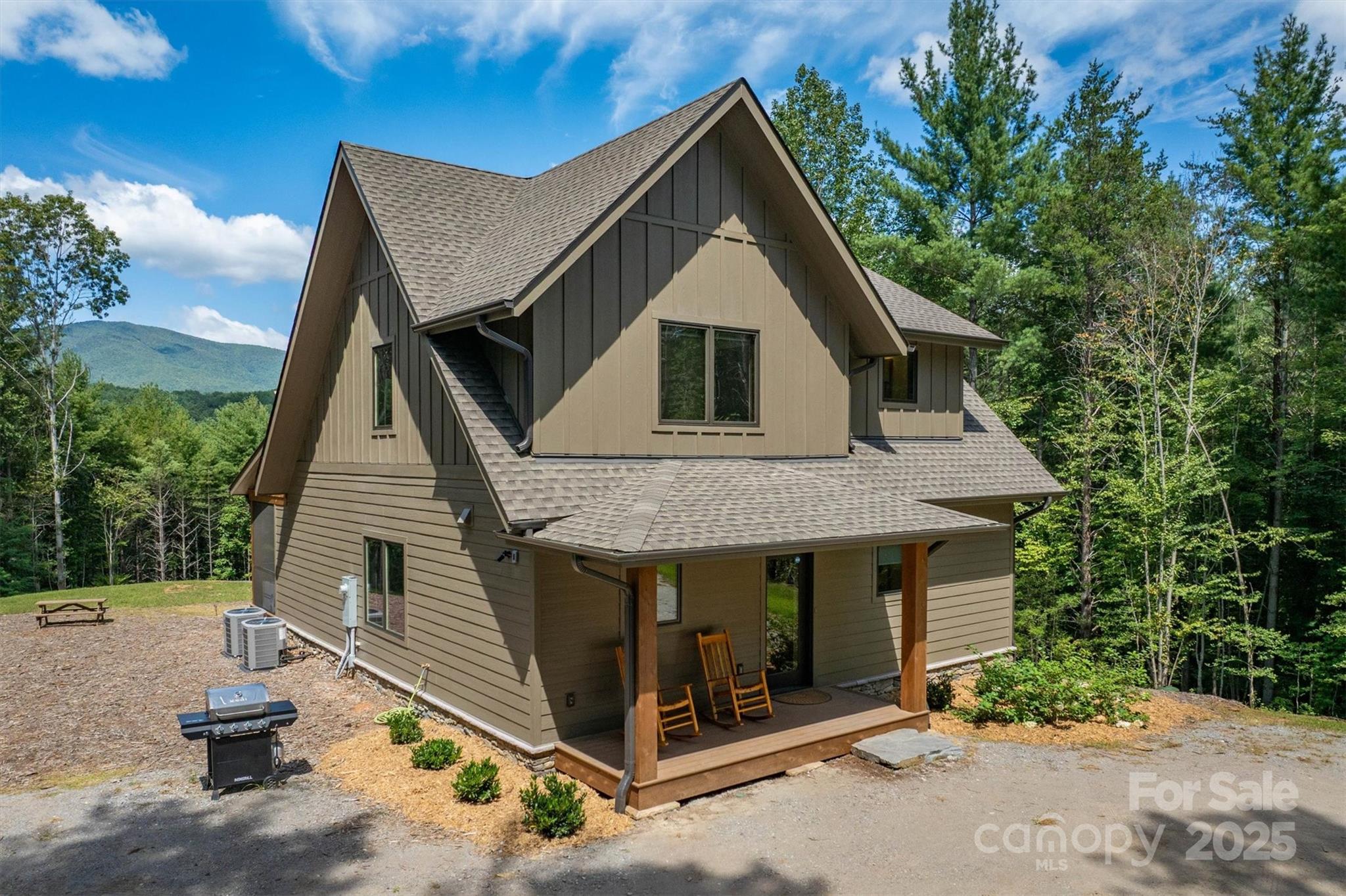1370 Saylor Way, Unit 8 Nebo, NC 28761 - Photo 5 of 44 a front view of a house with garden