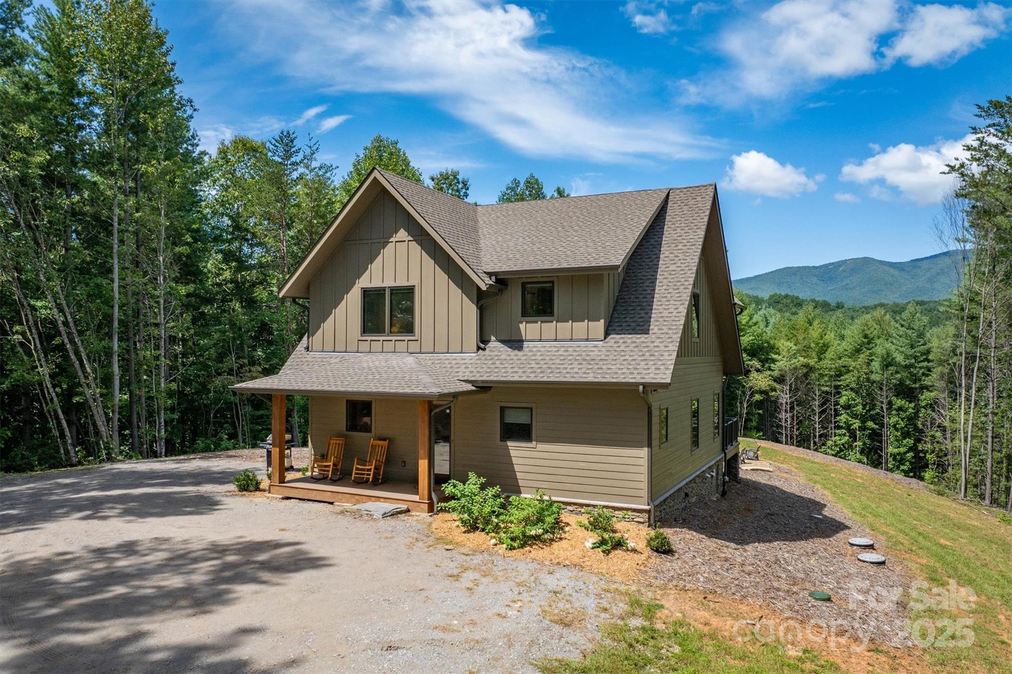 1370 Saylor Way, Unit 8 Nebo, NC 28761 - Photo 6 of 44 a front view of a house with yard and seating area