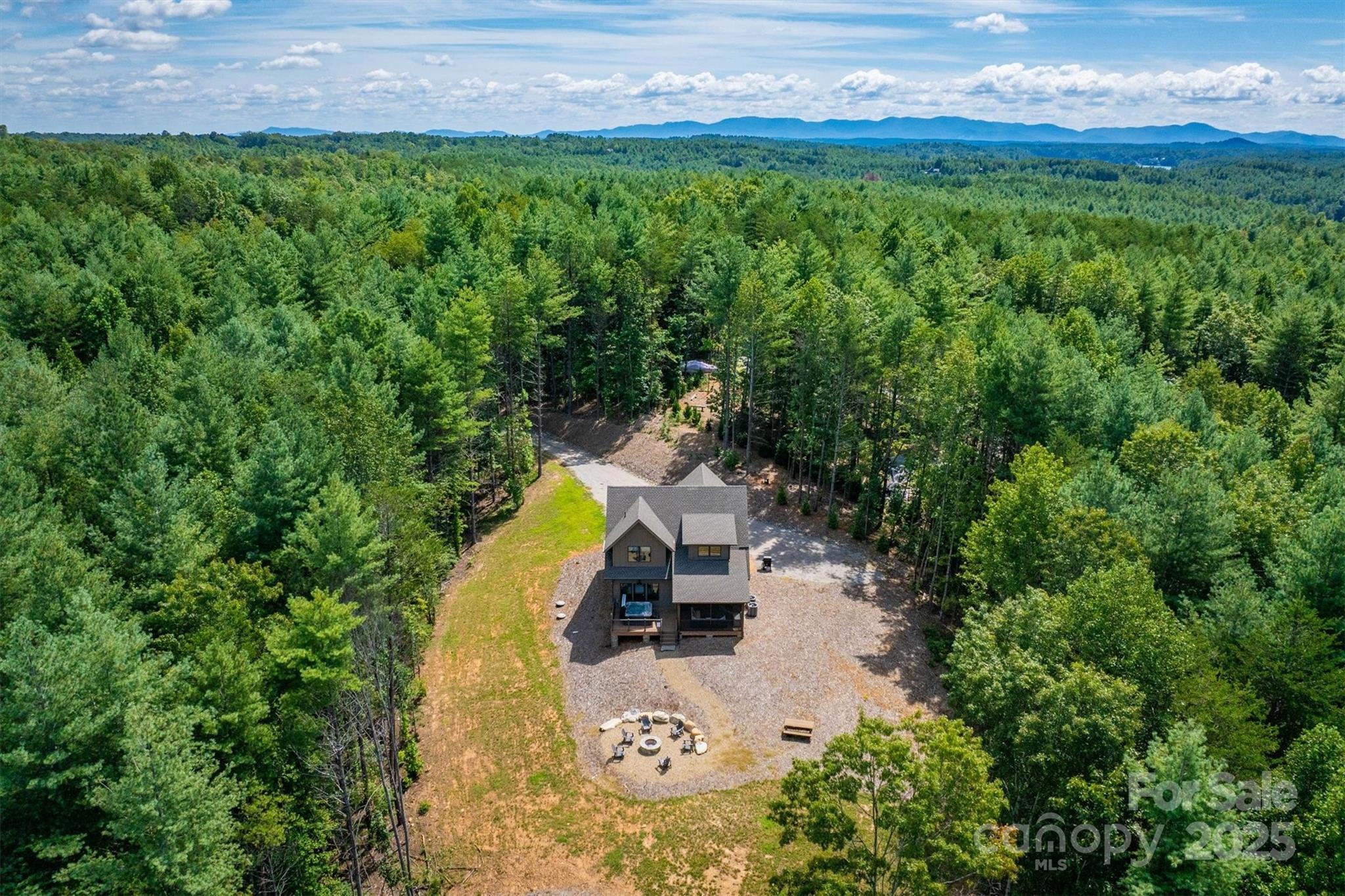 1370 Saylor Way, Unit 8 Nebo, NC 28761 - Photo 9 of 44 a view of a swimming pool with a yard and large trees